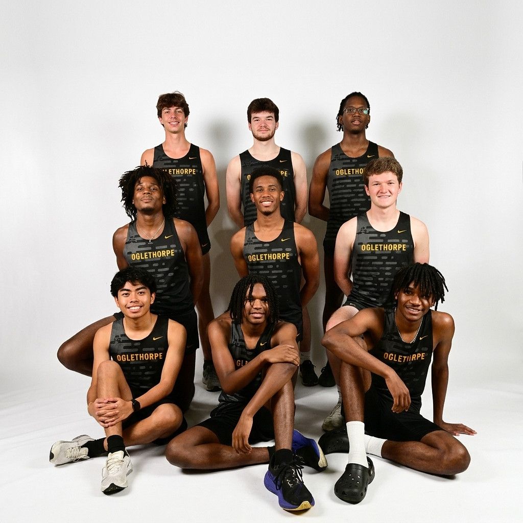 Oglethorpe university track and field team poses for a group photo in black and gold uniforms against a white background.