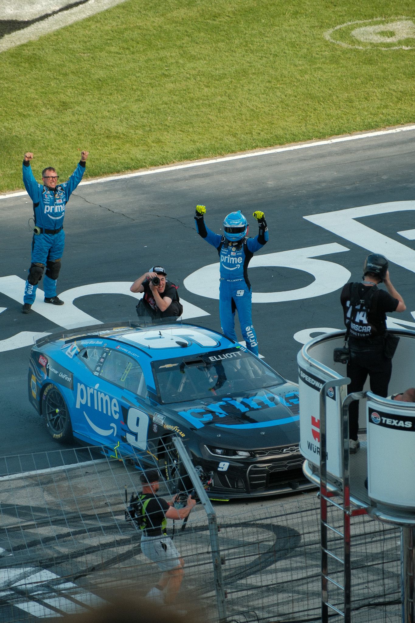 Chase Elliott celebrates victory in his #9 Amazon Prime sponsored NASCAR race car at Texas Motor Speedway.