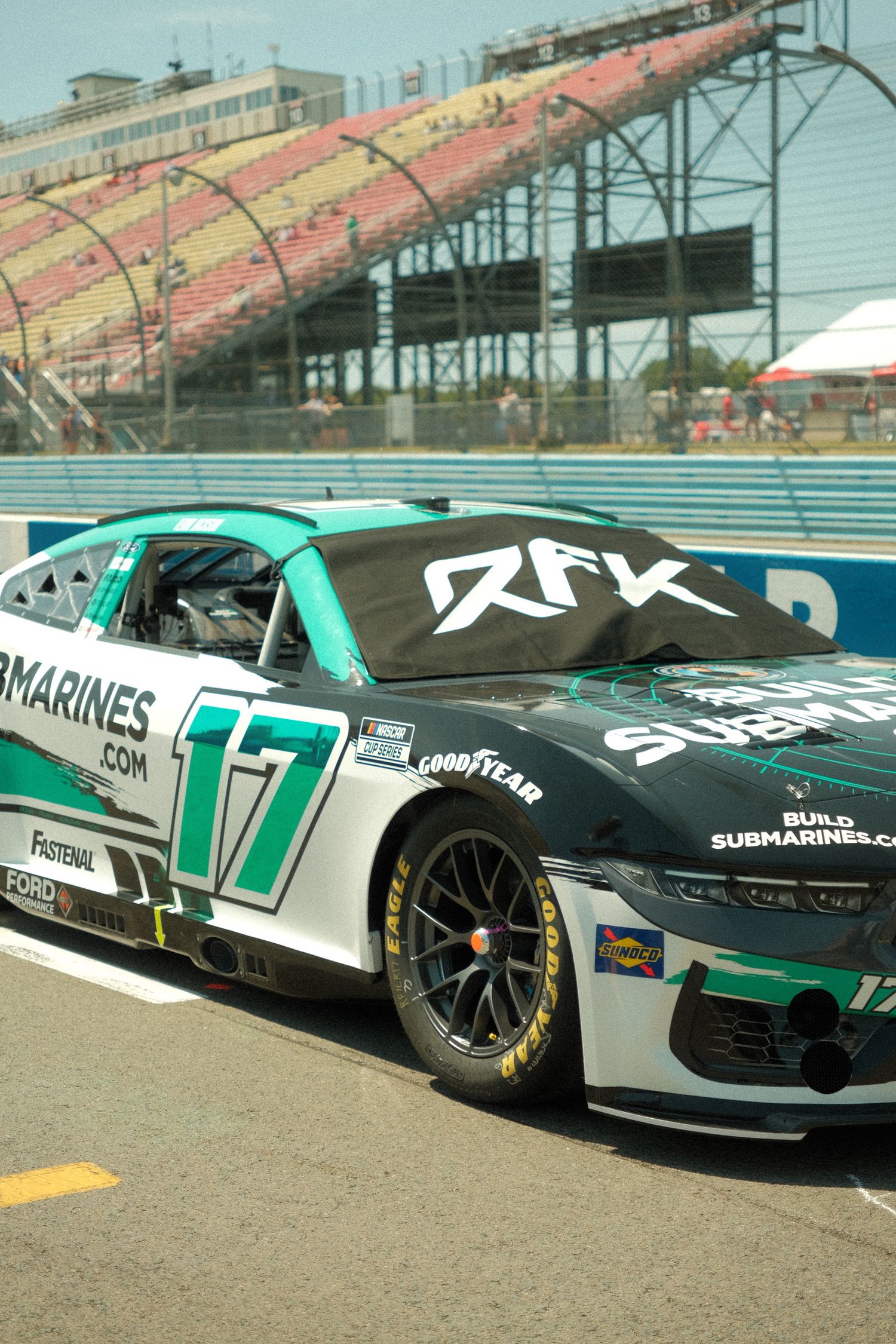 RFK Racing No. 17 NASCAR Cup Series car with submarine sponsorship livery parked on pit road at Watkins Glen.