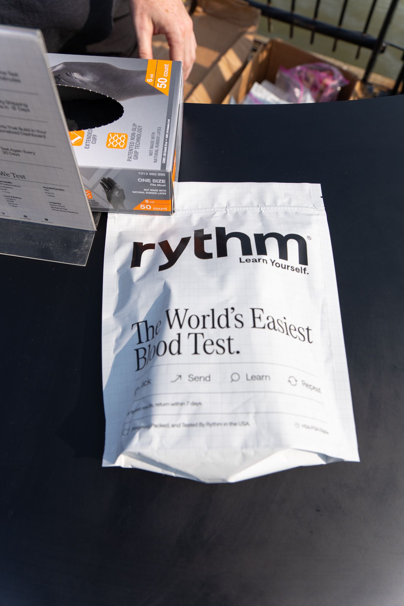 Rythm blood test kit bag on a table with the tagline The World's Easiest Blood Test.