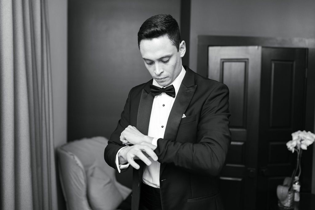 Groom in tux getting ready for wedding at Hotel Domestique