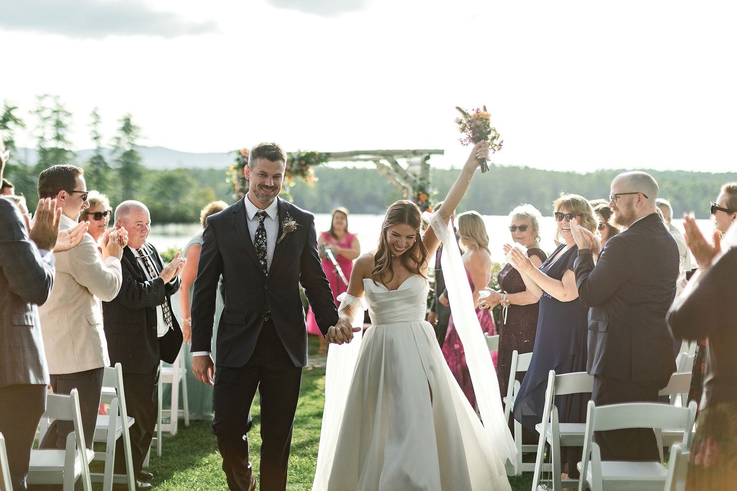 Bride and groom exit their wedding ceremony at Tarry A While Resort, Bridgton Maine