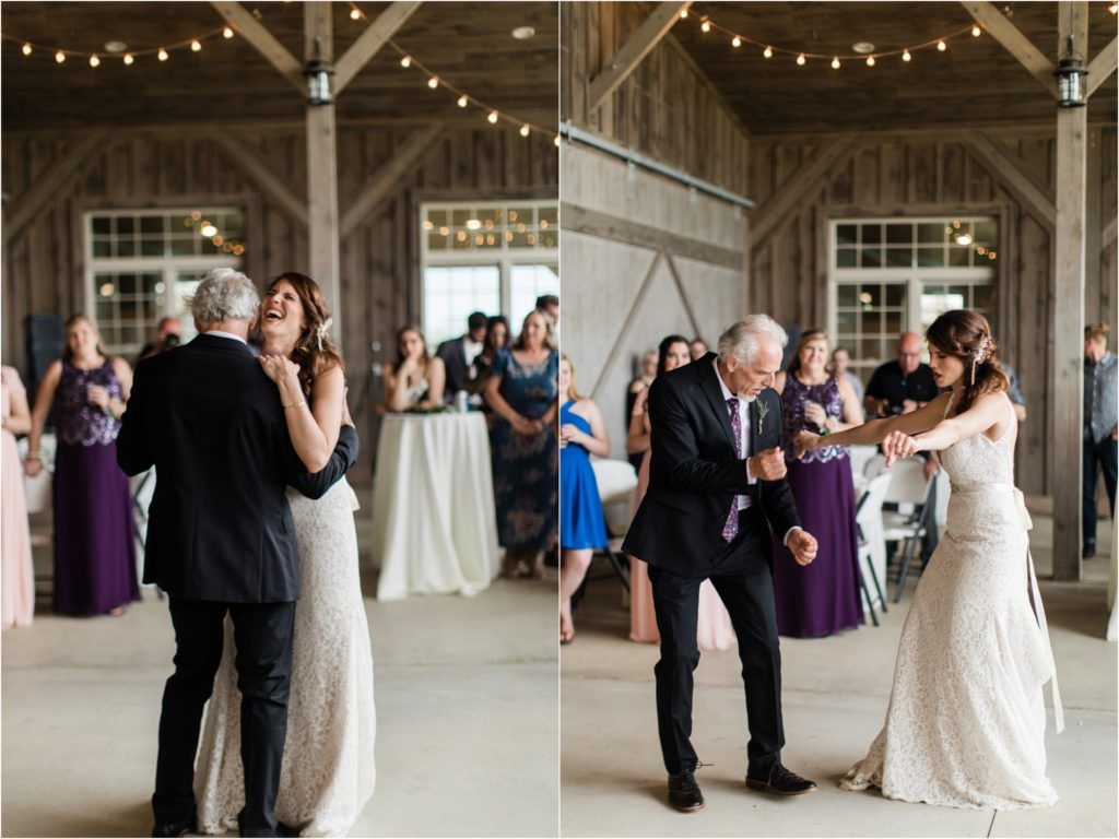 An emotional dance between two people at a wedding celebration in a rustic barn setting.