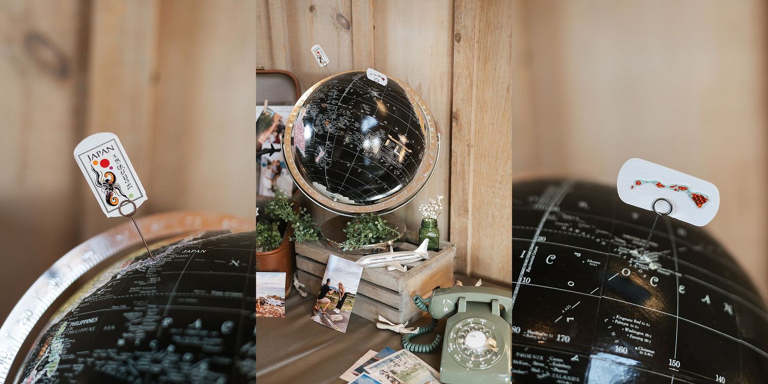 A disco ball reflects light in a wooden framed display against a beige background with small decorative tags.