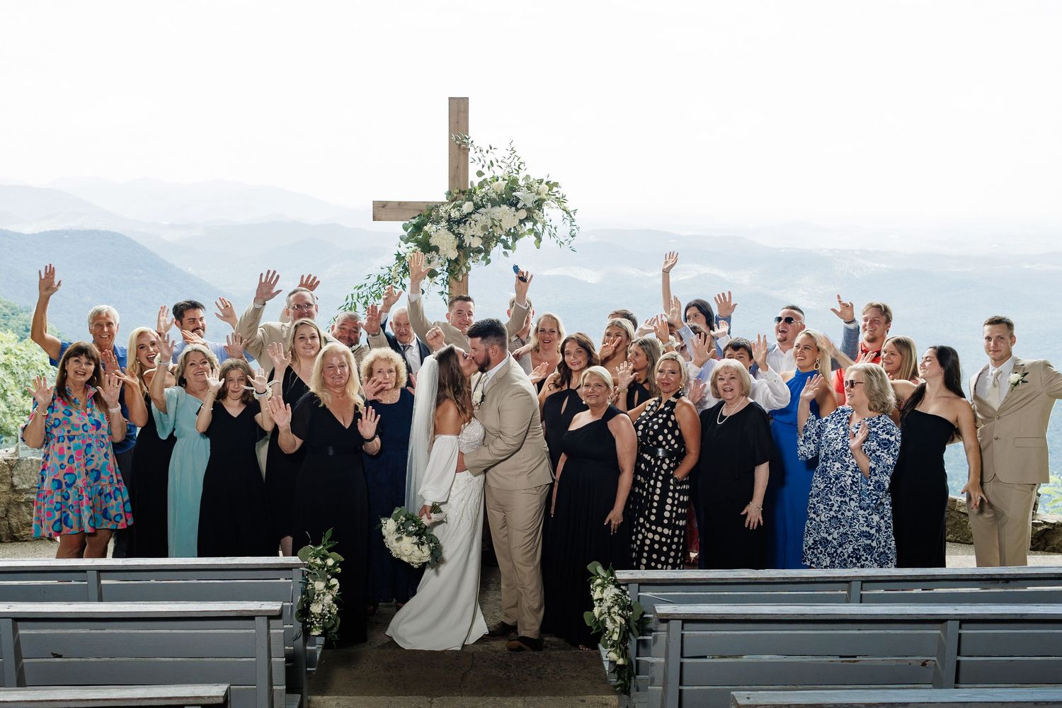 A sequence of wedding party photos showing joyful celebration poses on a balcony with scenic mountain views in the background.