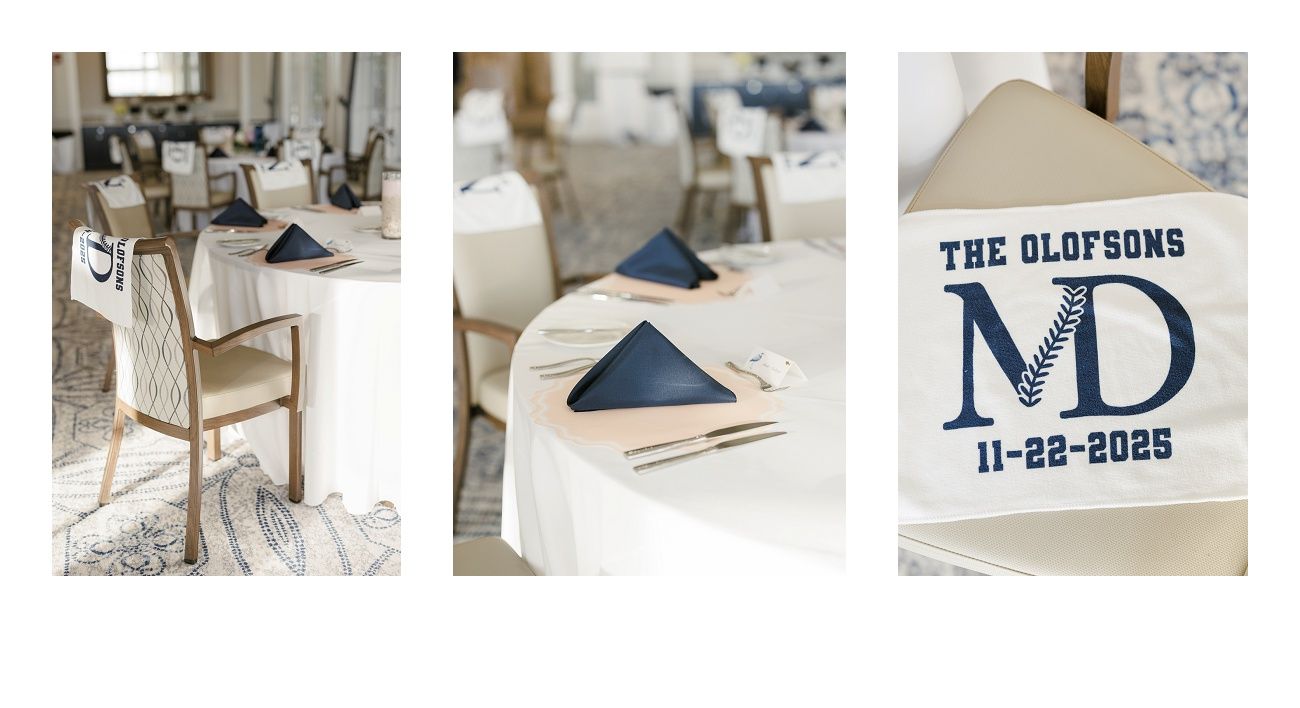 Wedding reception details featuring navy blue napkins, white chairs, and personalized monogram signage.