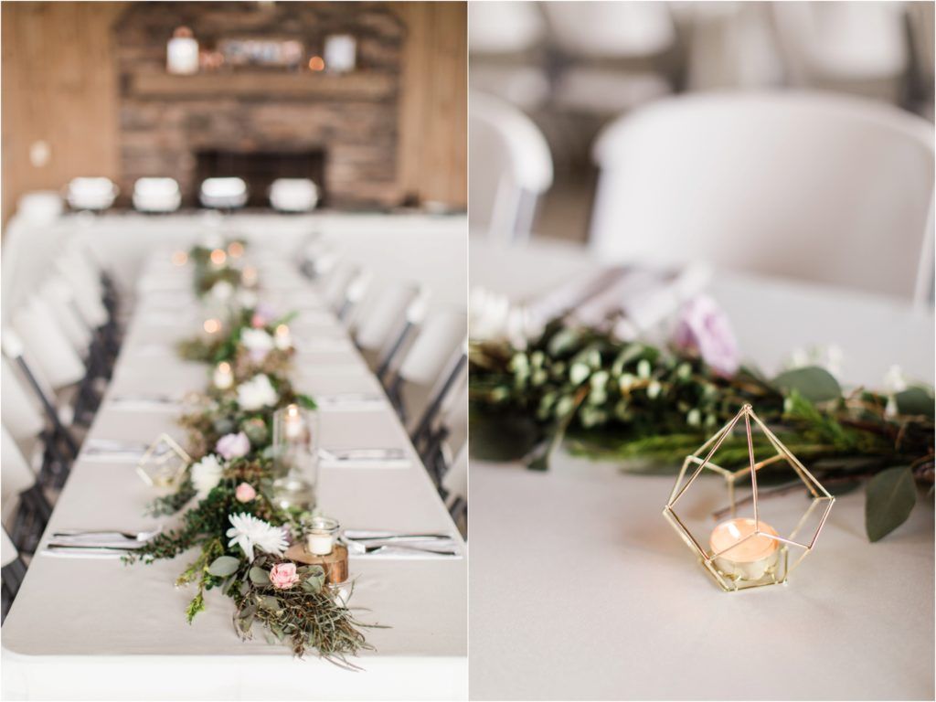 Elegant wedding table decor with greenery garlands and geometric gold candle holders.