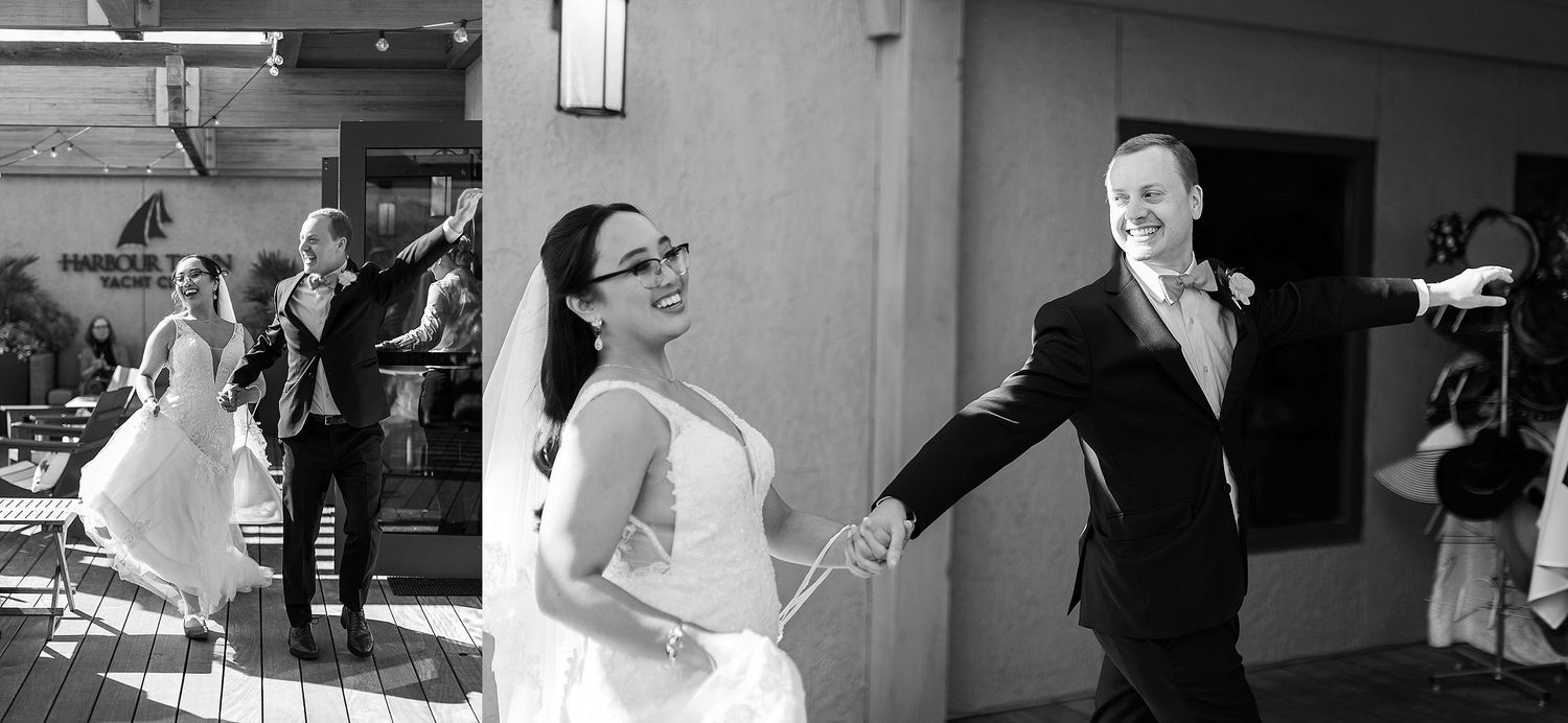 A black and white wedding photo showing a joyful dance moment during a celebration.
