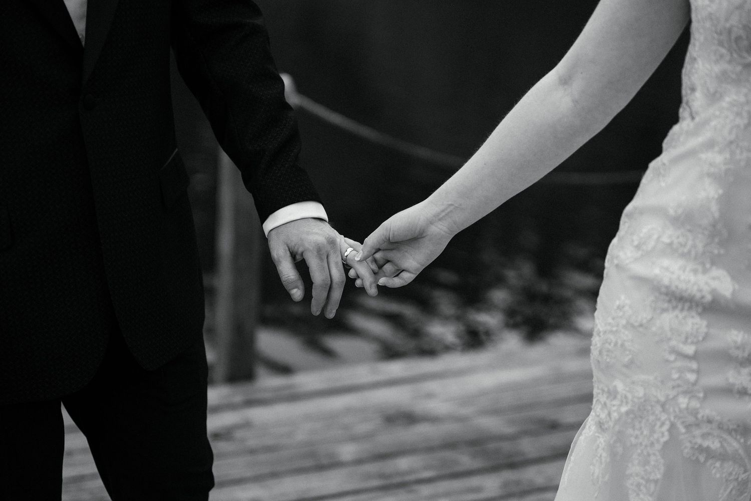 Dance partners perform an elegant spin on the dance floor during a formal event wearing elegant black and white attire.