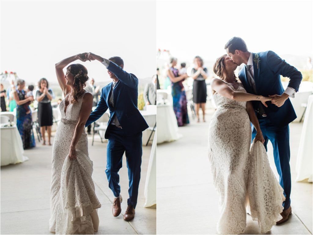 Wedding couple dancing together in elegant attire at their reception.
