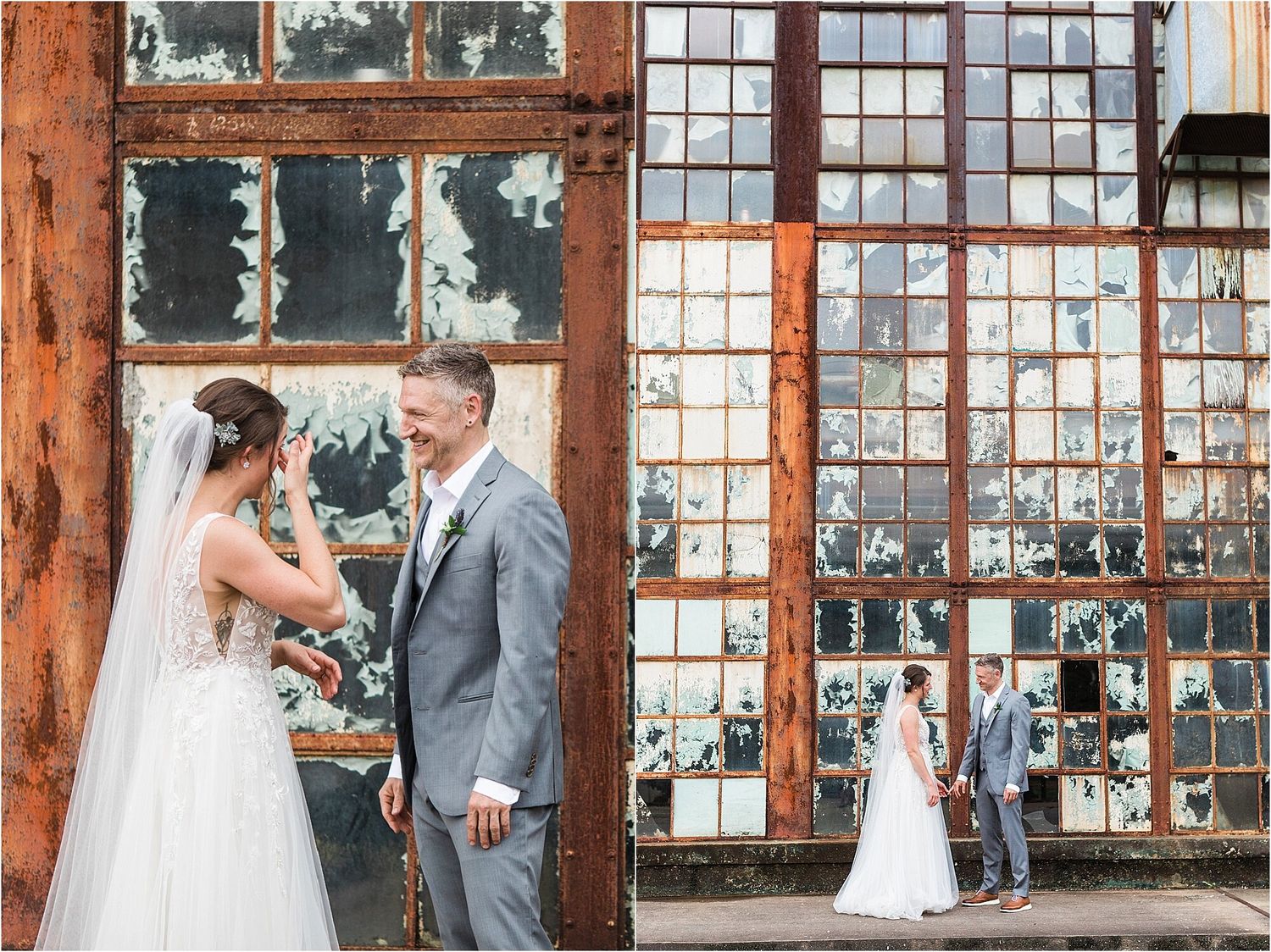 Wedding couple poses against rustic industrial windows with peeling paint and wooden beams.