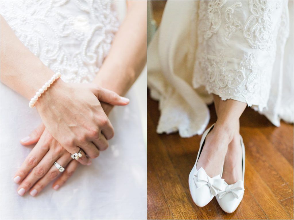 Wedding details showing pearl bracelet, engagement ring and white bow flats.