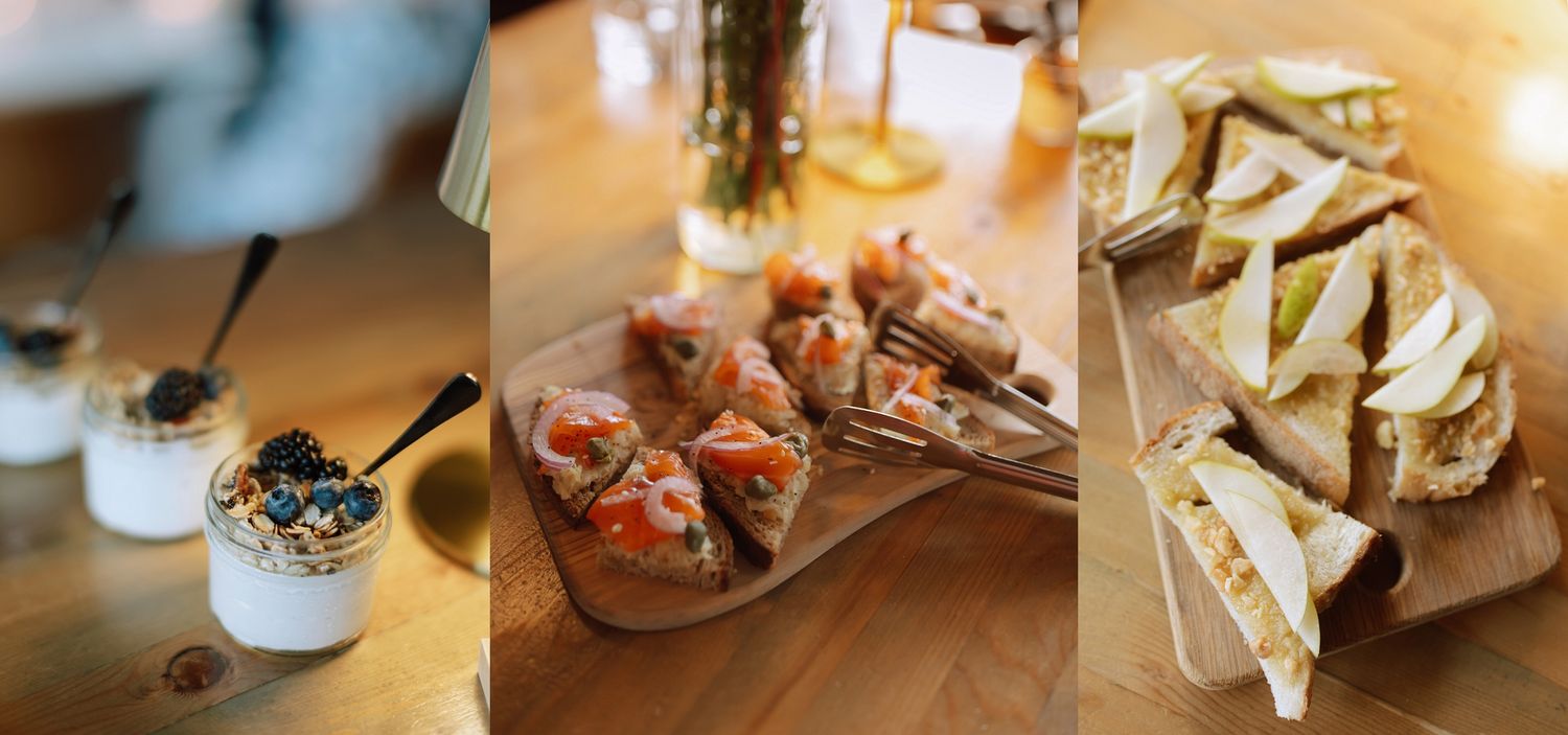 Wedding reception appetizers displayed on wooden boards including smoked salmon bites and sandwiches.