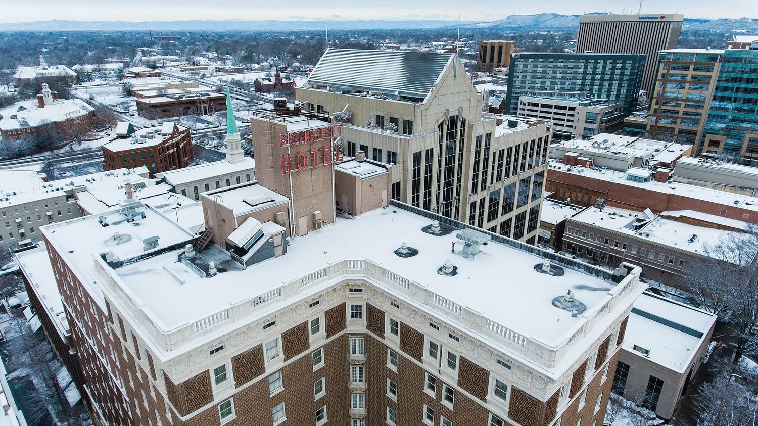 Aerial view of snow-covered urban buildings and architecture in winter.