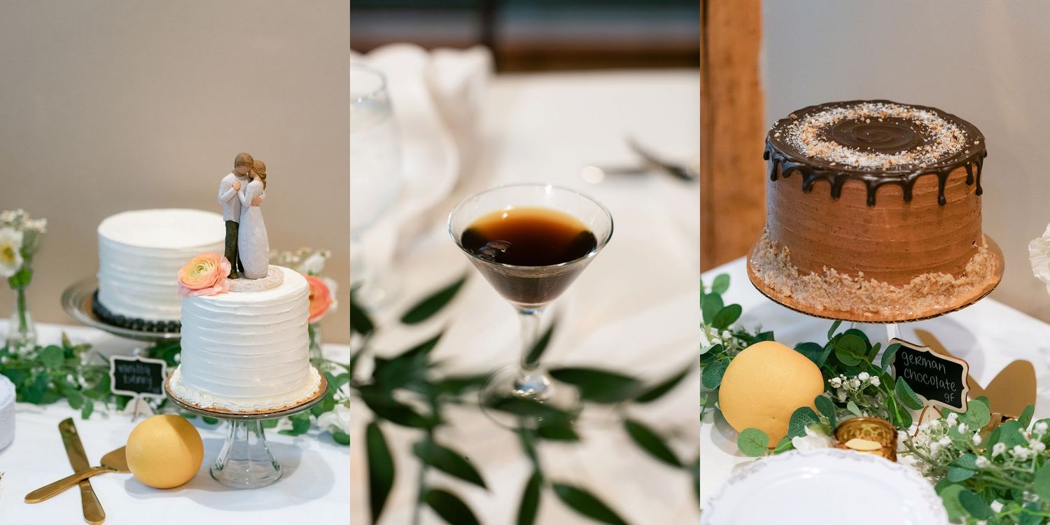Wedding cake with white and chocolate frosting decorated with citrus fruits and greenery on display.
