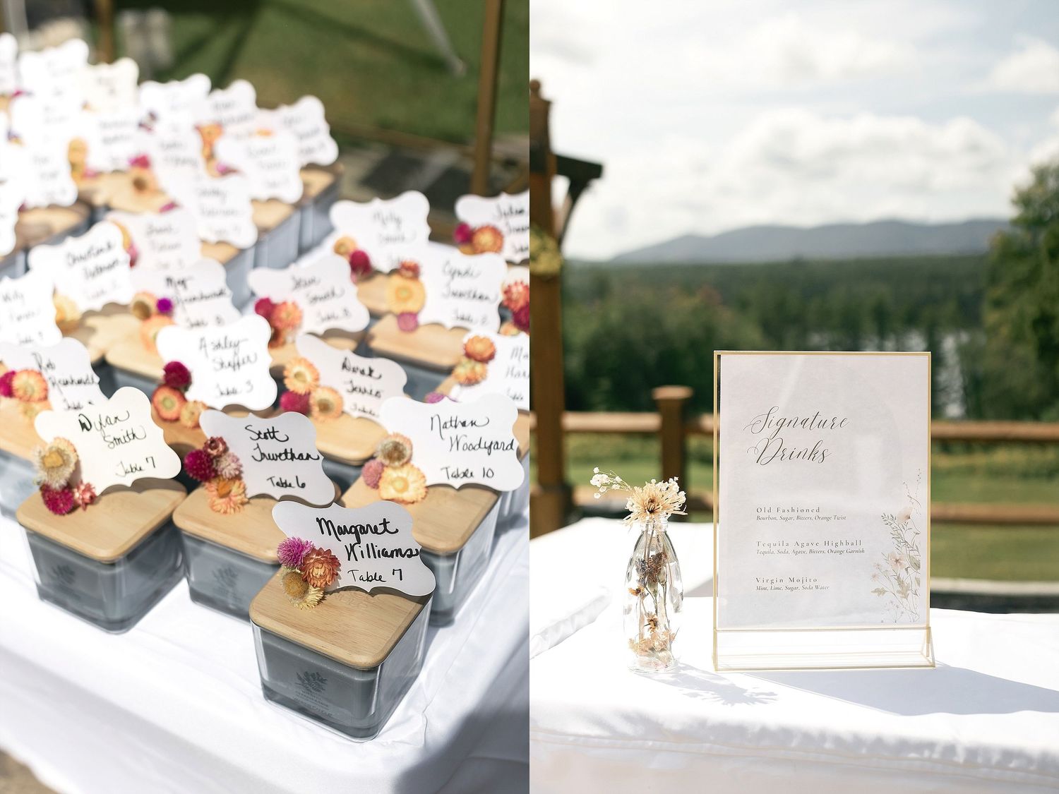 Wedding favor boxes and seating cards displayed on white linen covered table with mountain view.