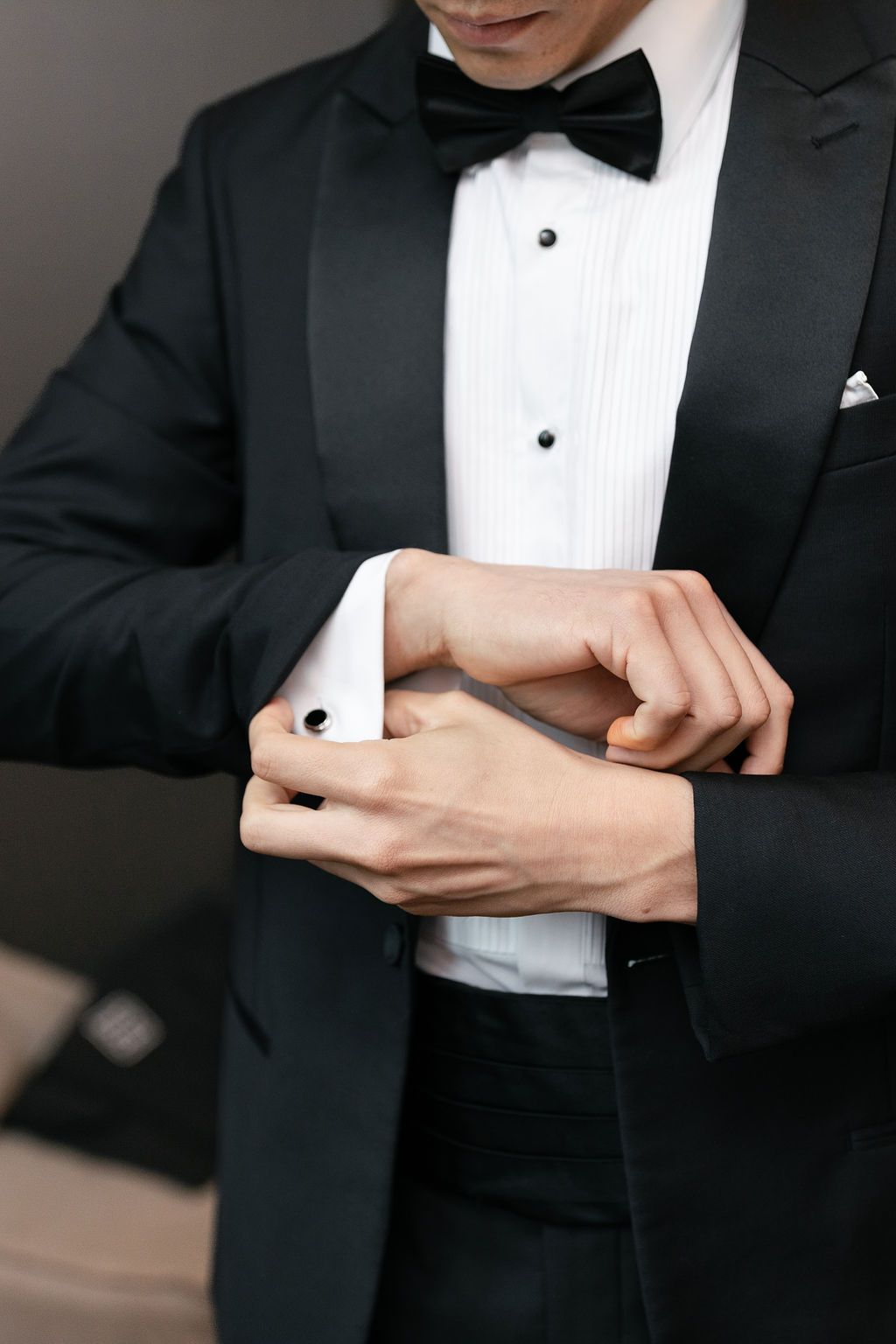 Groom in tux getting ready for wedding at Hotel Domestique