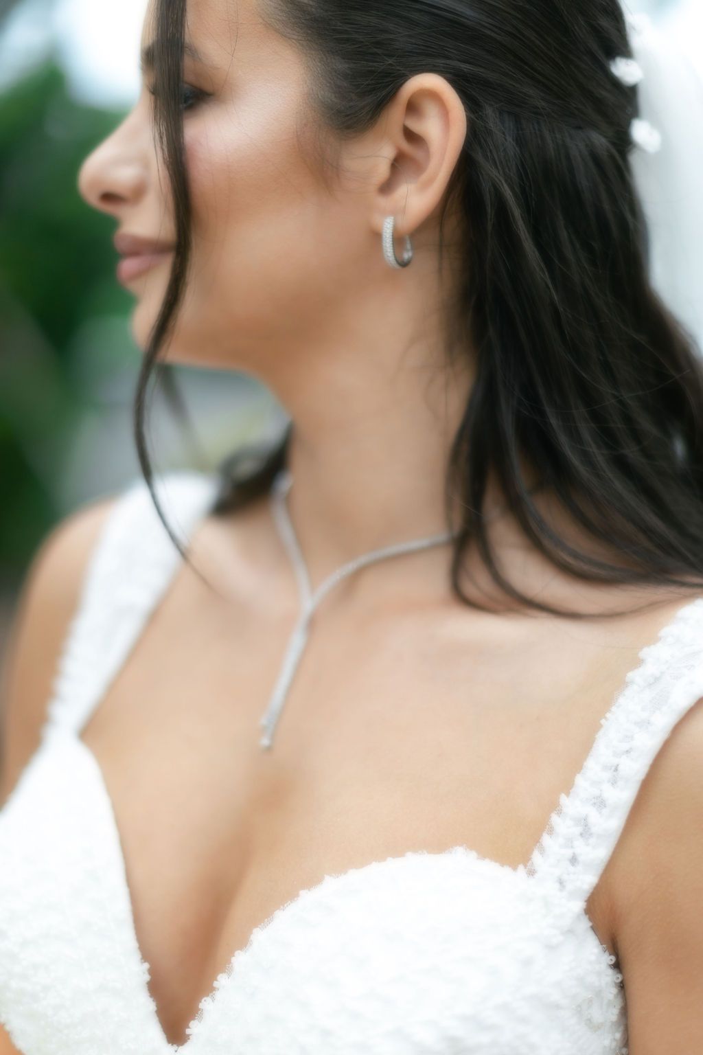 Film inspired wedding photography portrait of bride featuring jewelry