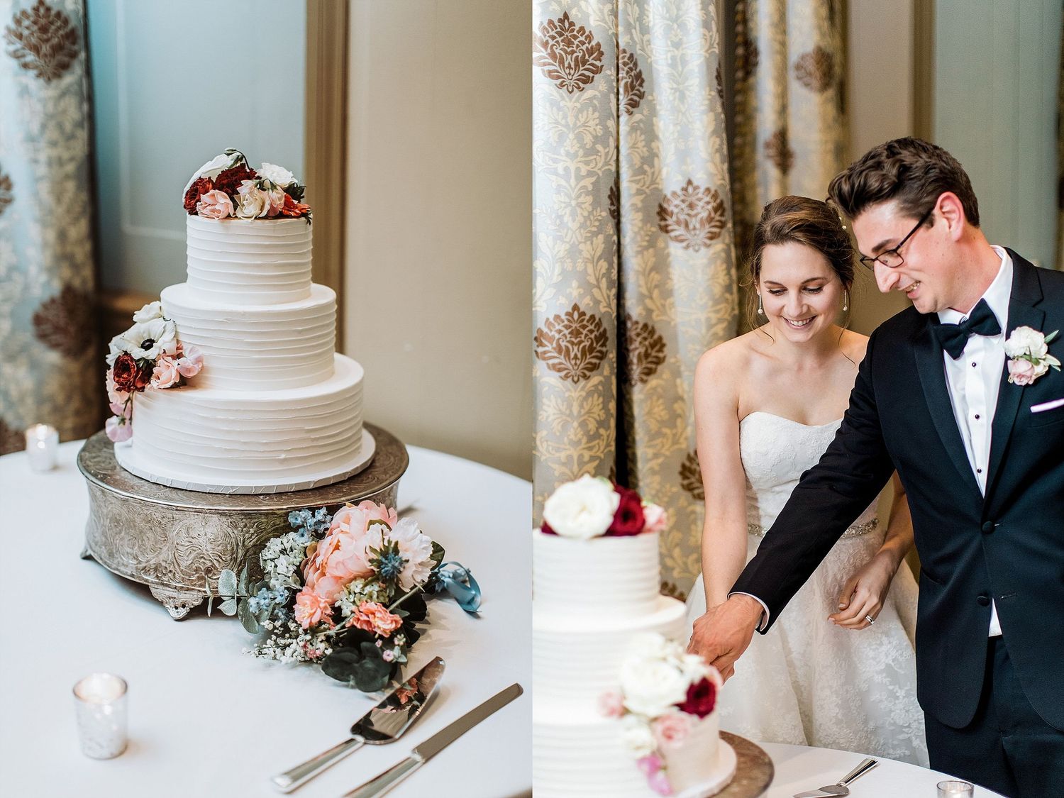 A white tiered wedding cake with pink flowers and a couple cutting it together.