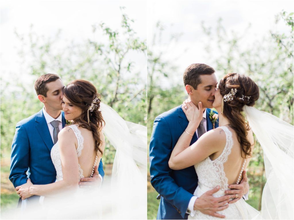 Side-by-side romantic portraits of couple in blue suit and white dress among spring blossoms.