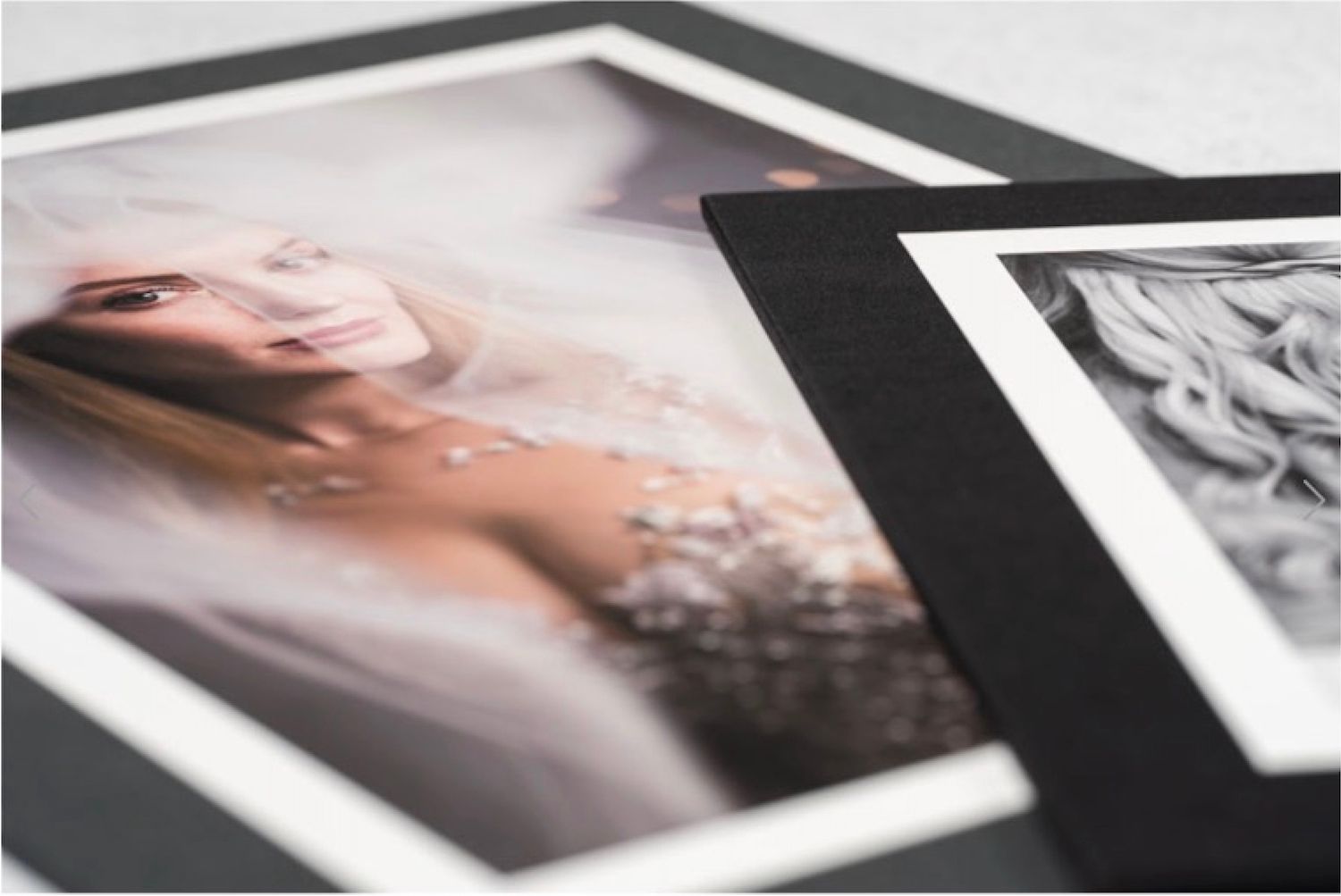 High-end matted fine art prints of a bride in a beaded gown elegantly displayed on a surface.