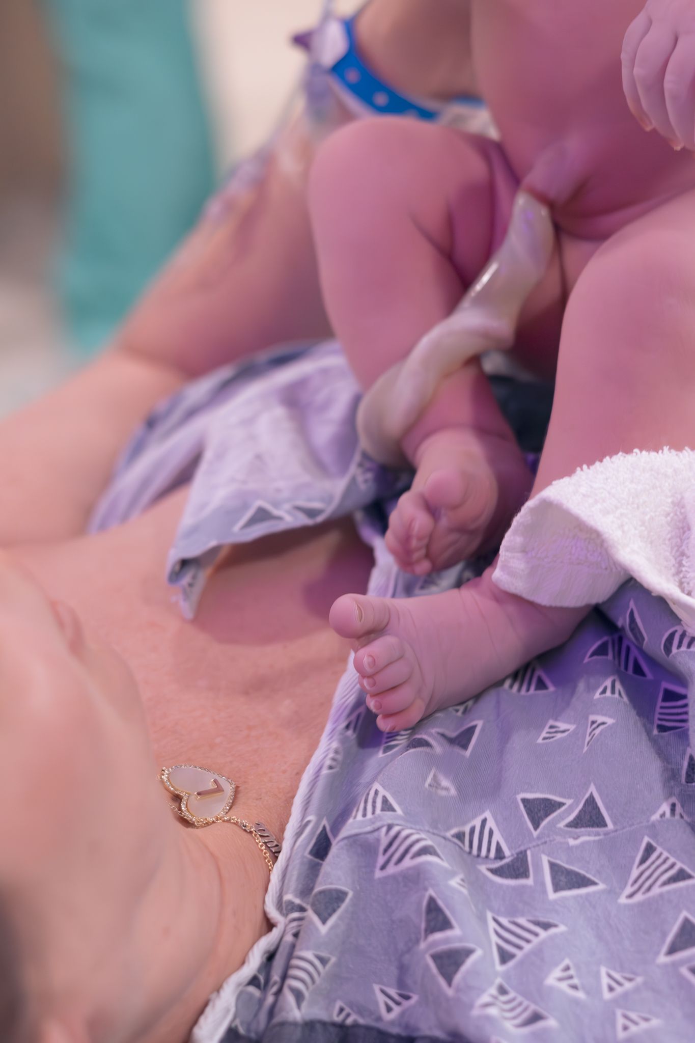 Newborn baby placed skin to skin on mom right after birth