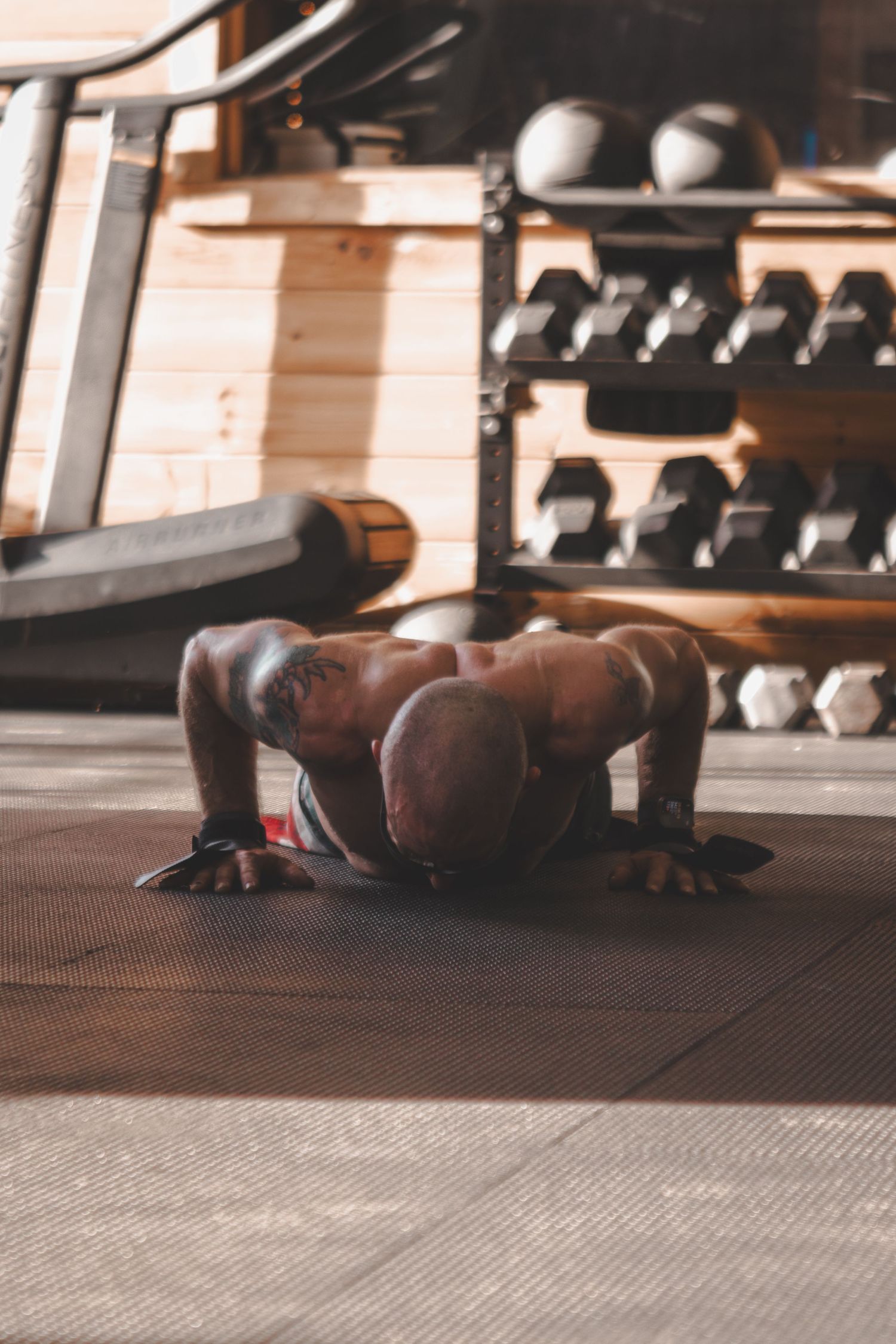 Athlete doing push-ups on the gym floor