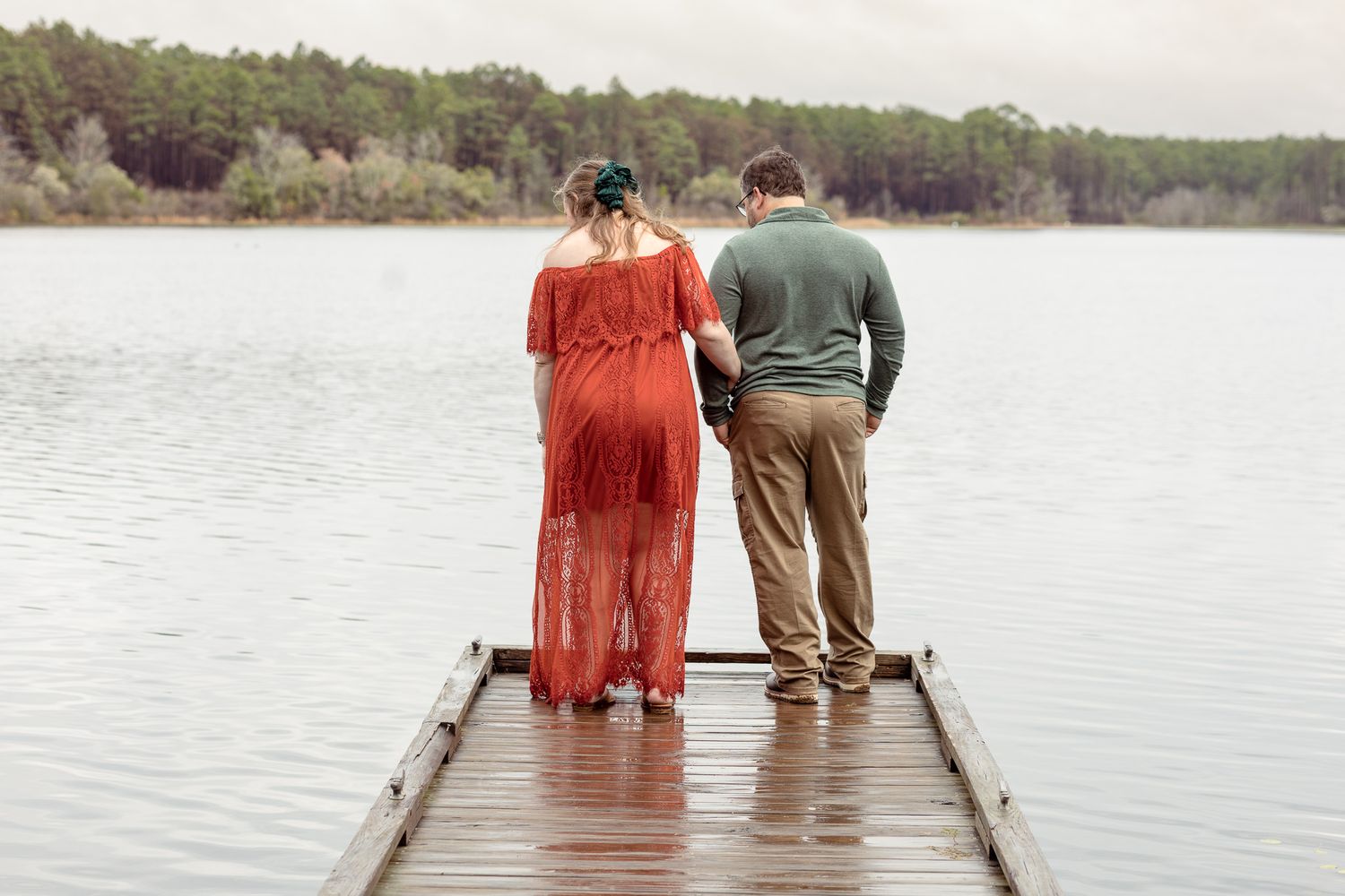 Expecting couple standing on a dock at Bear Lake during a maternity session
