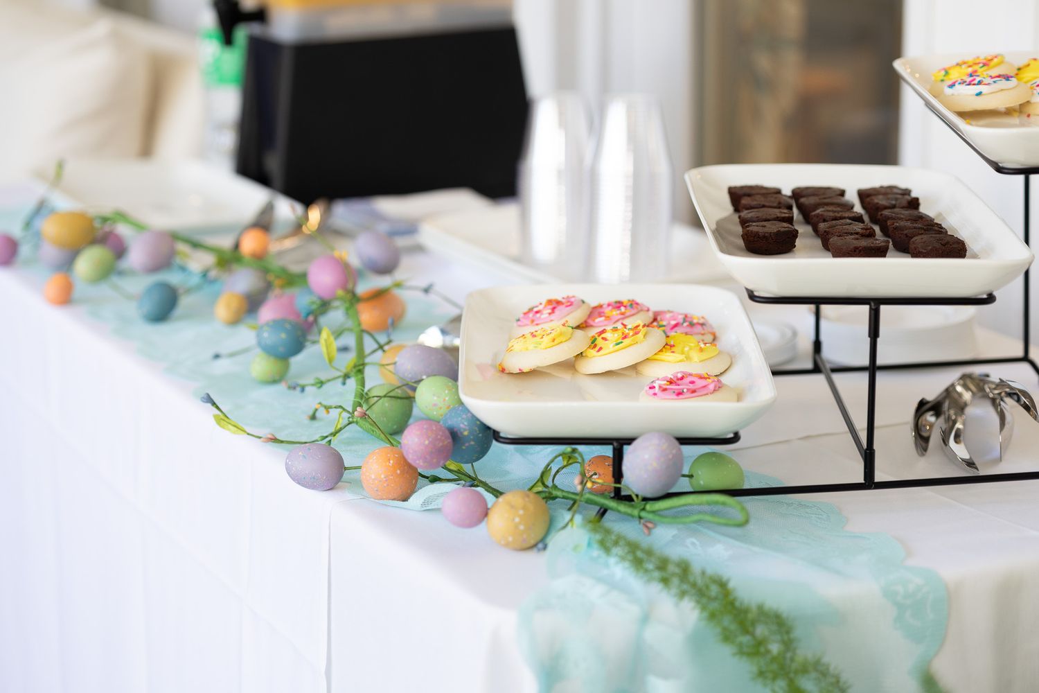 Dessert table with pastel treats at a spring event
