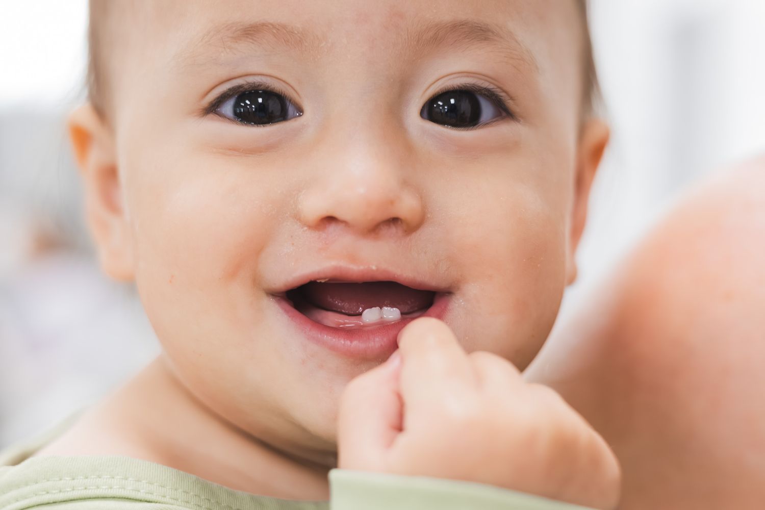 Smiling baby at a family baby shower in Pensacola, FL