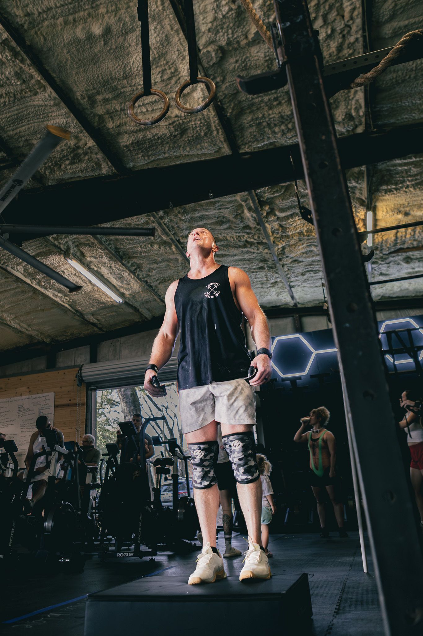 Athlete standing on a box during a gym competition
