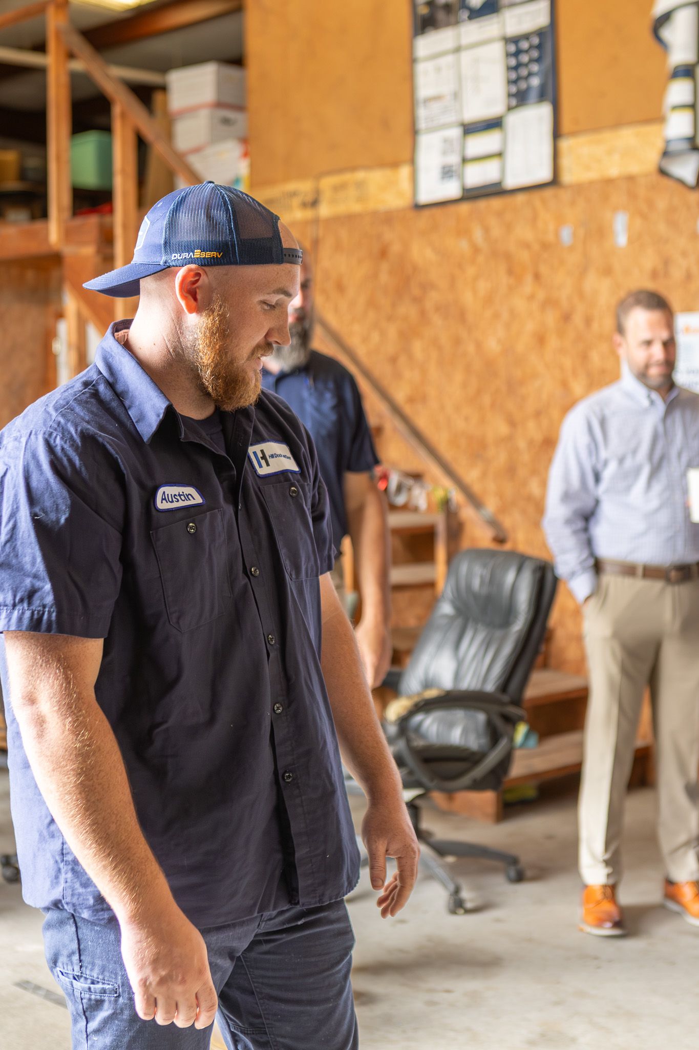 Employee in a work uniform laughing during a company event