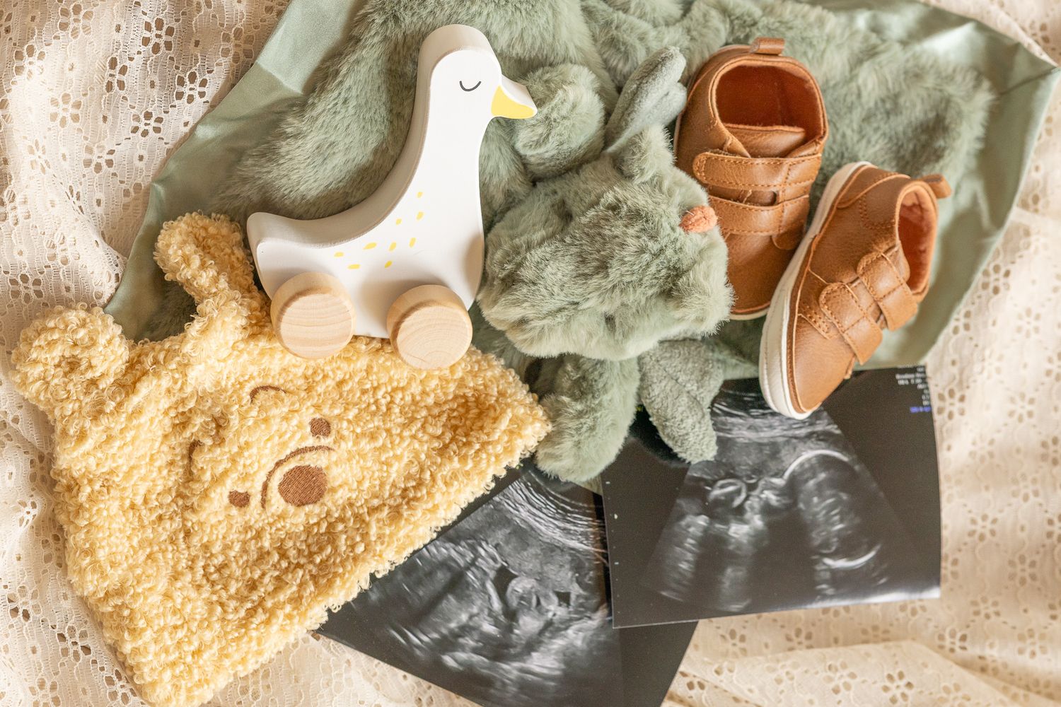 Knit baby booties and keepsakes laid out for a maternity session in Milton, FL