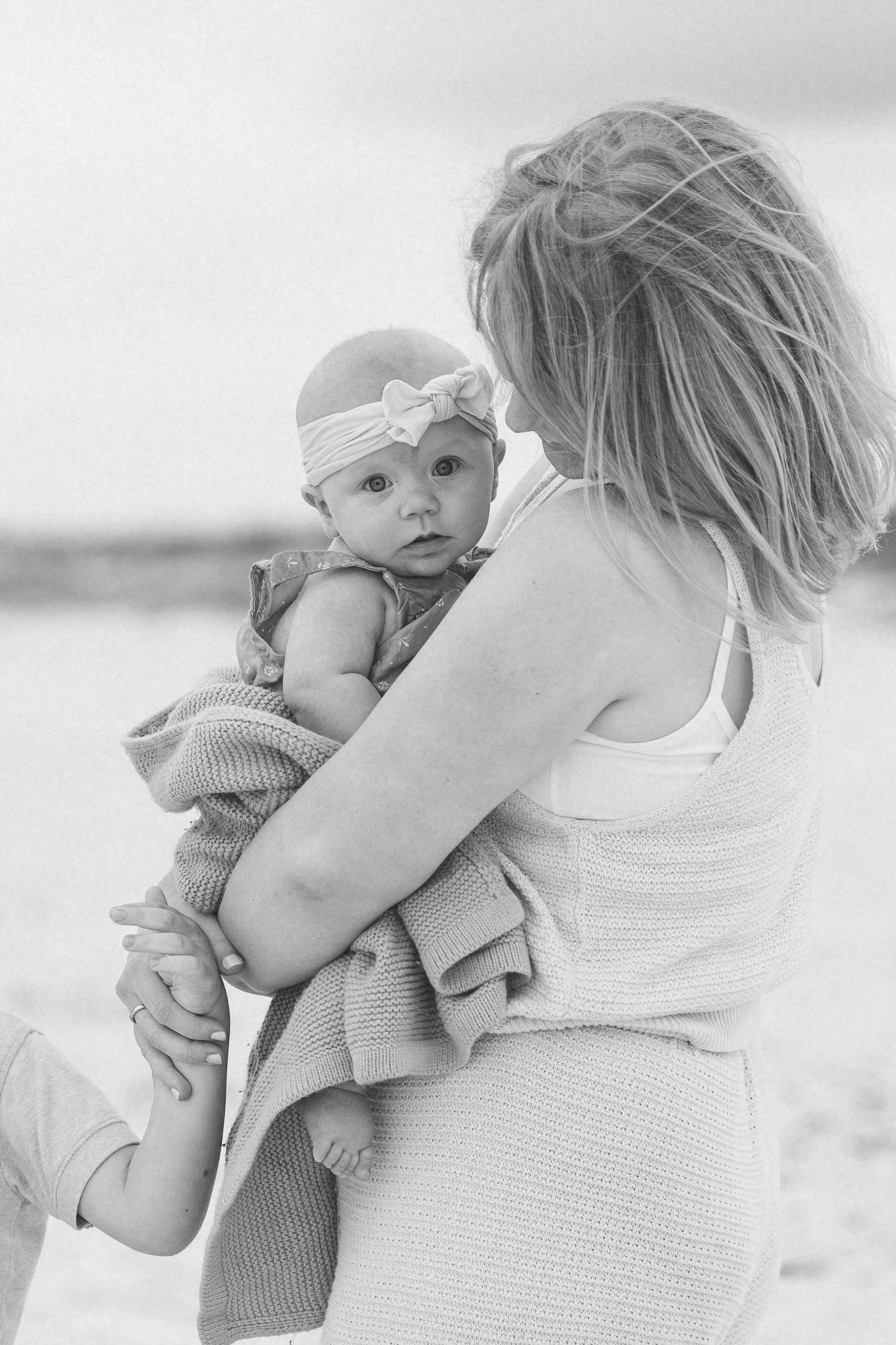 Black and white photo of a mom holding her baby
