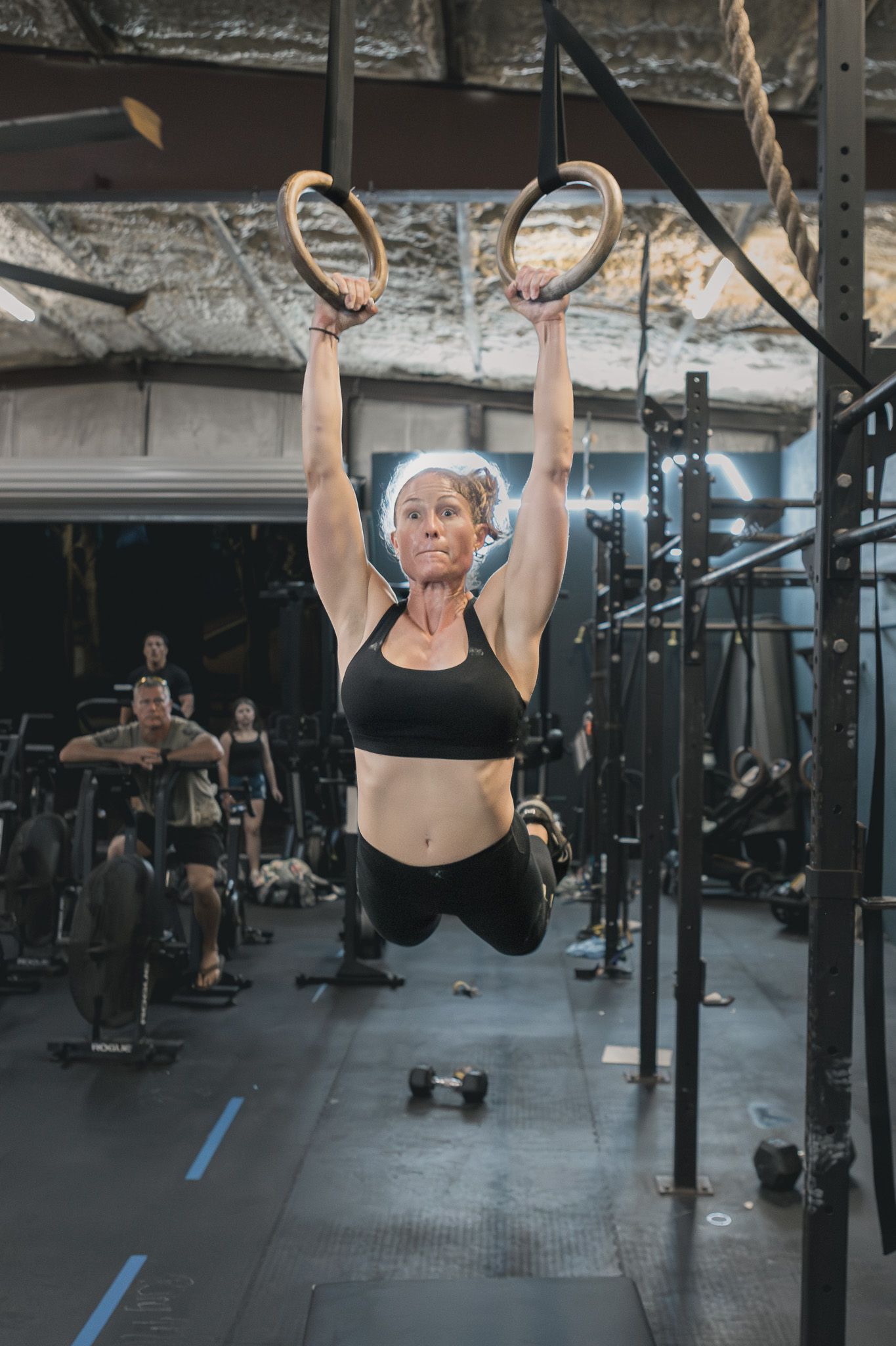 Athlete doing a ring exercise during a CrossFit gym event