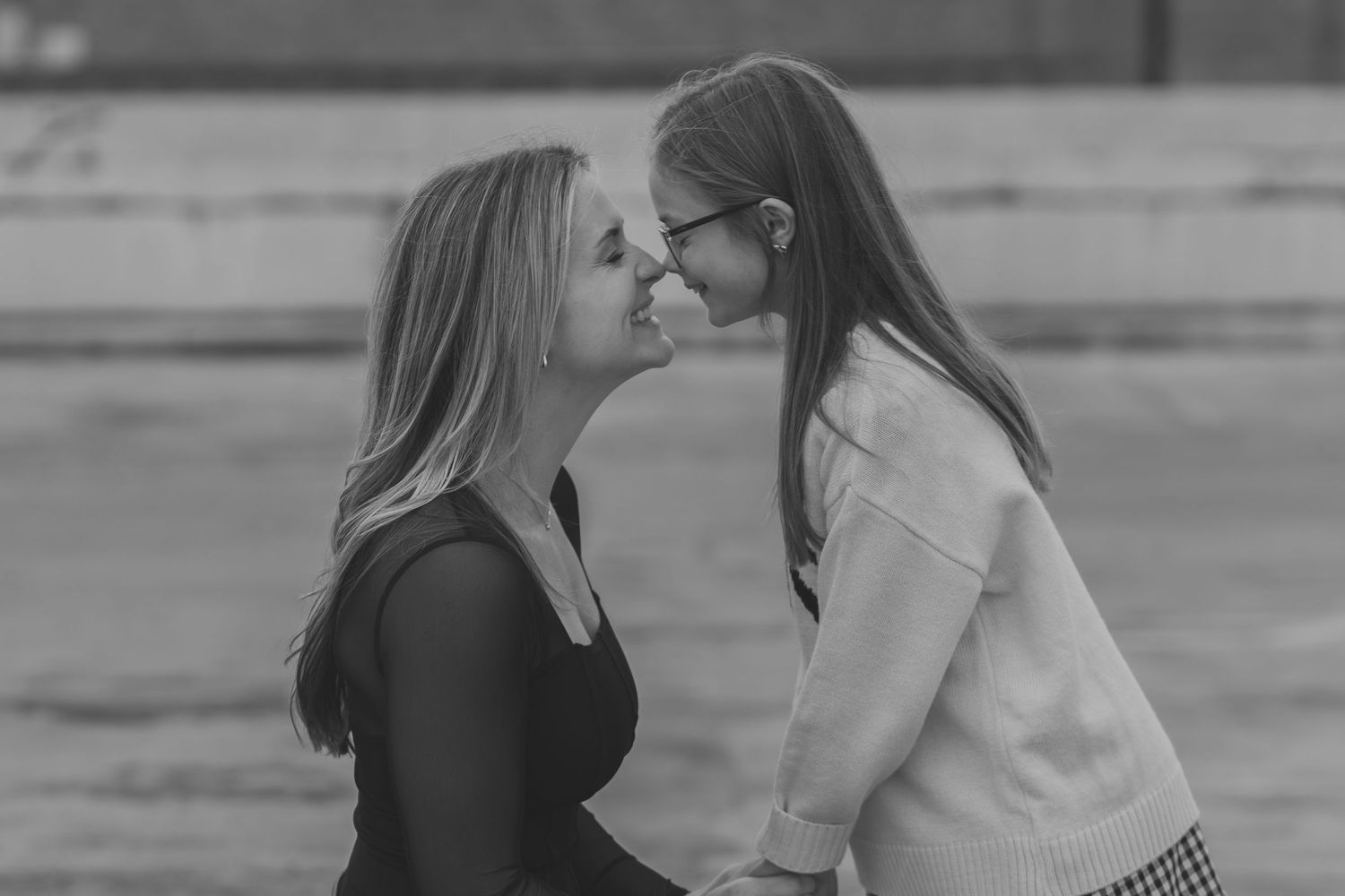 Black and white photo of a couple sharing a kiss