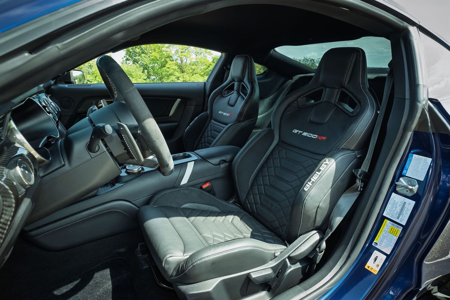 Luxurious black leather GT500 interior with sport bucket seats featuring Shelby GT500 embroidered headrests.