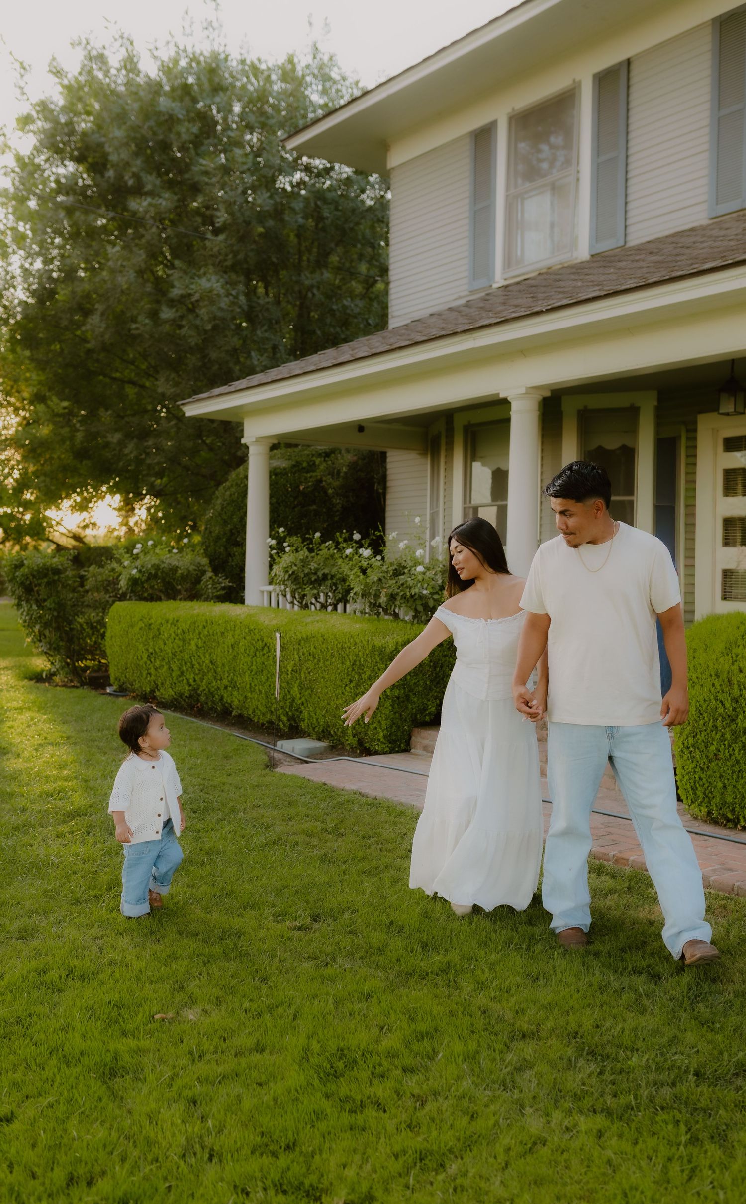 warm editorial shot of family at charm house in California