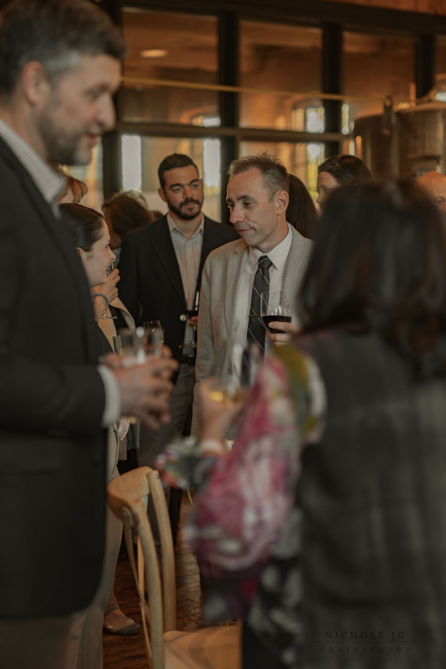 Event photo of guests celebrating in Hudson Valley venue, candid & inclusive. Captured by Nichole JG Photography.