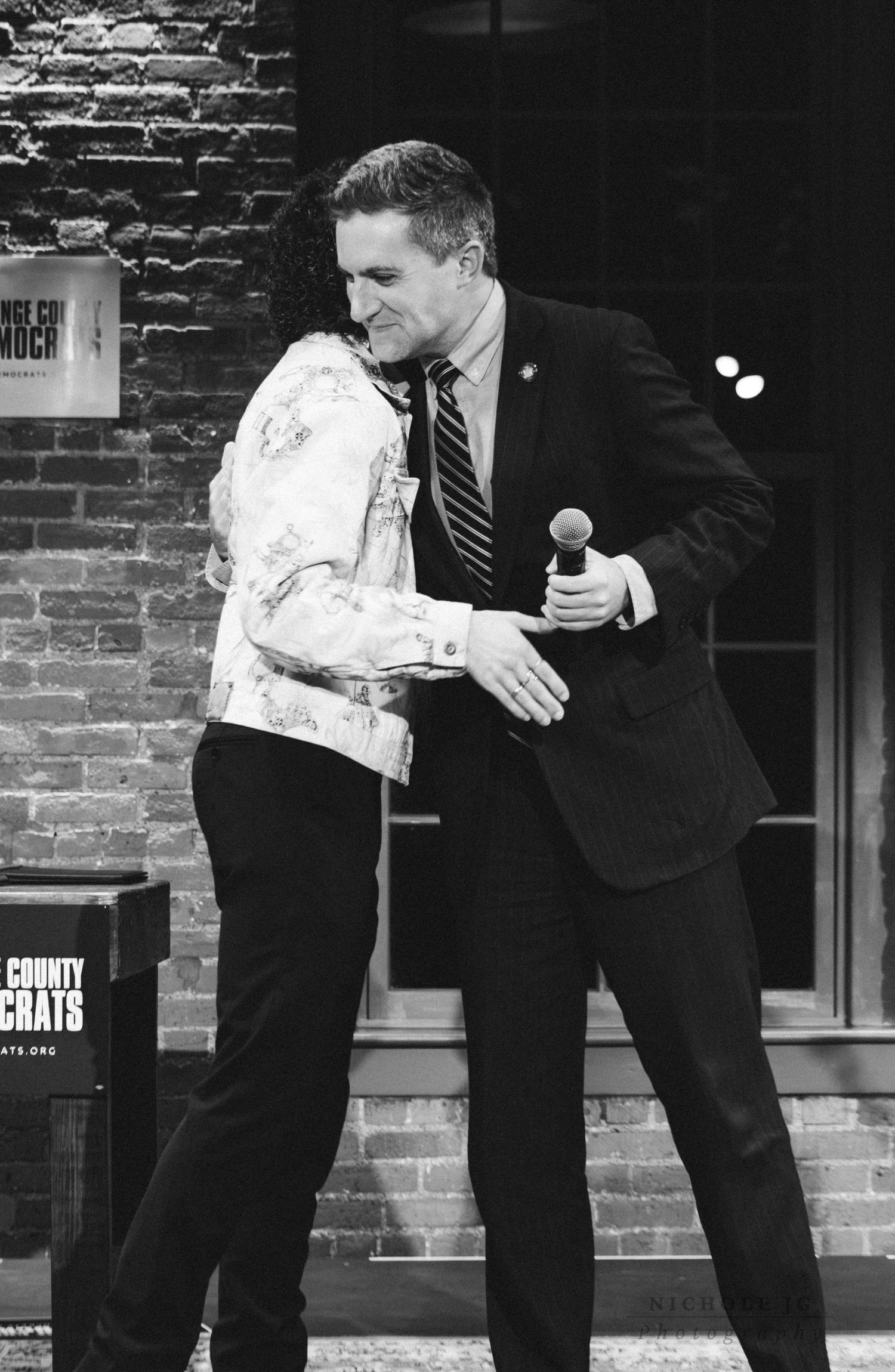 Event photo of guests celebrating in Hudson Valley venue, candid & inclusive. Captured by Nichole JG Photography.