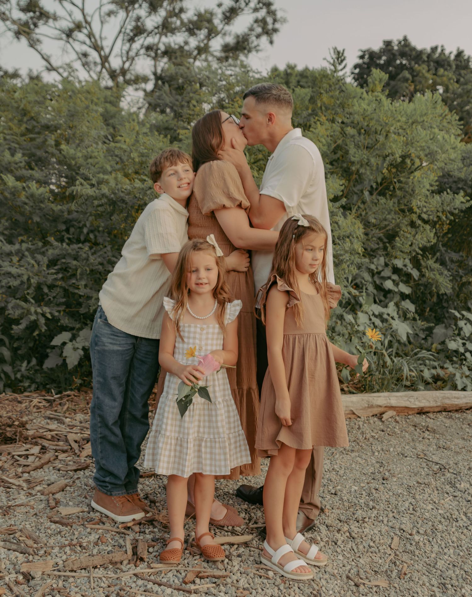 Sunset family portrait at Hudson Valley park, featuring warm, candid storytelling. Captured by Nichole JG Photography in Hudson Valley