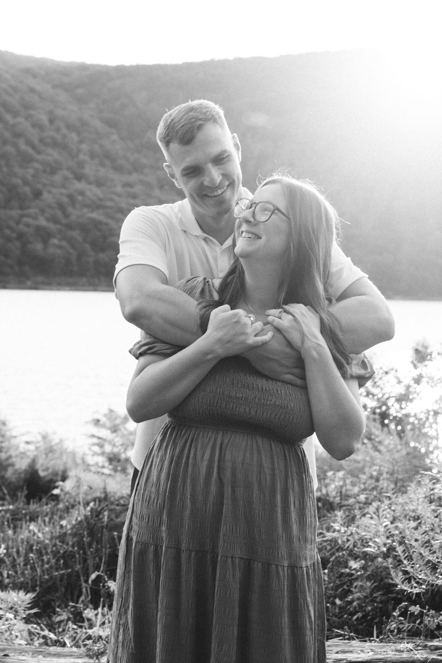 B&W portrait of couple at Hudson Valley park, featuring warm, candid storytelling. Captured by Nichole JG Photography in Hudson Valley