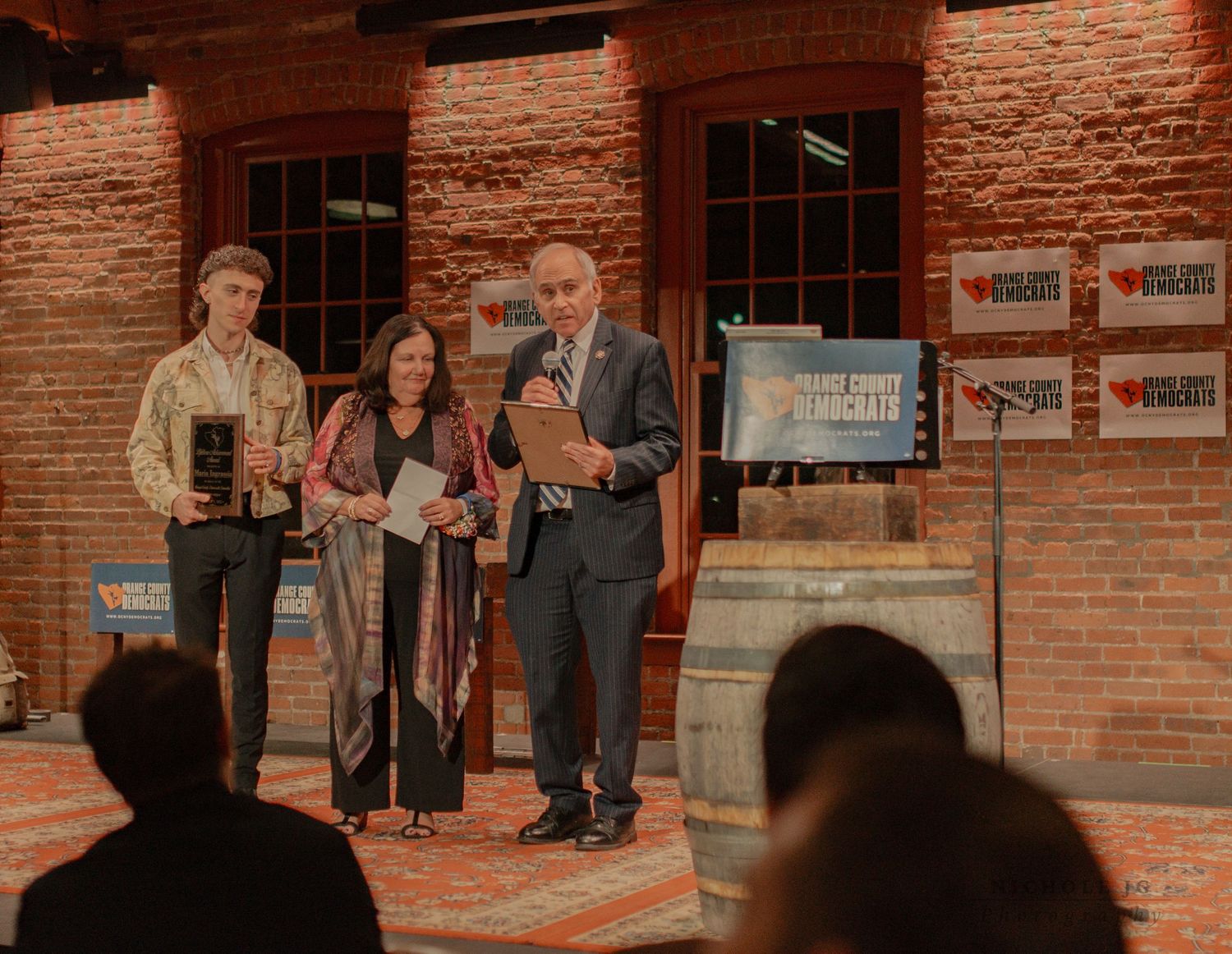 Event photo of guests celebrating in Hudson Valley venue, candid & inclusive. Captured by Nichole JG Photography.