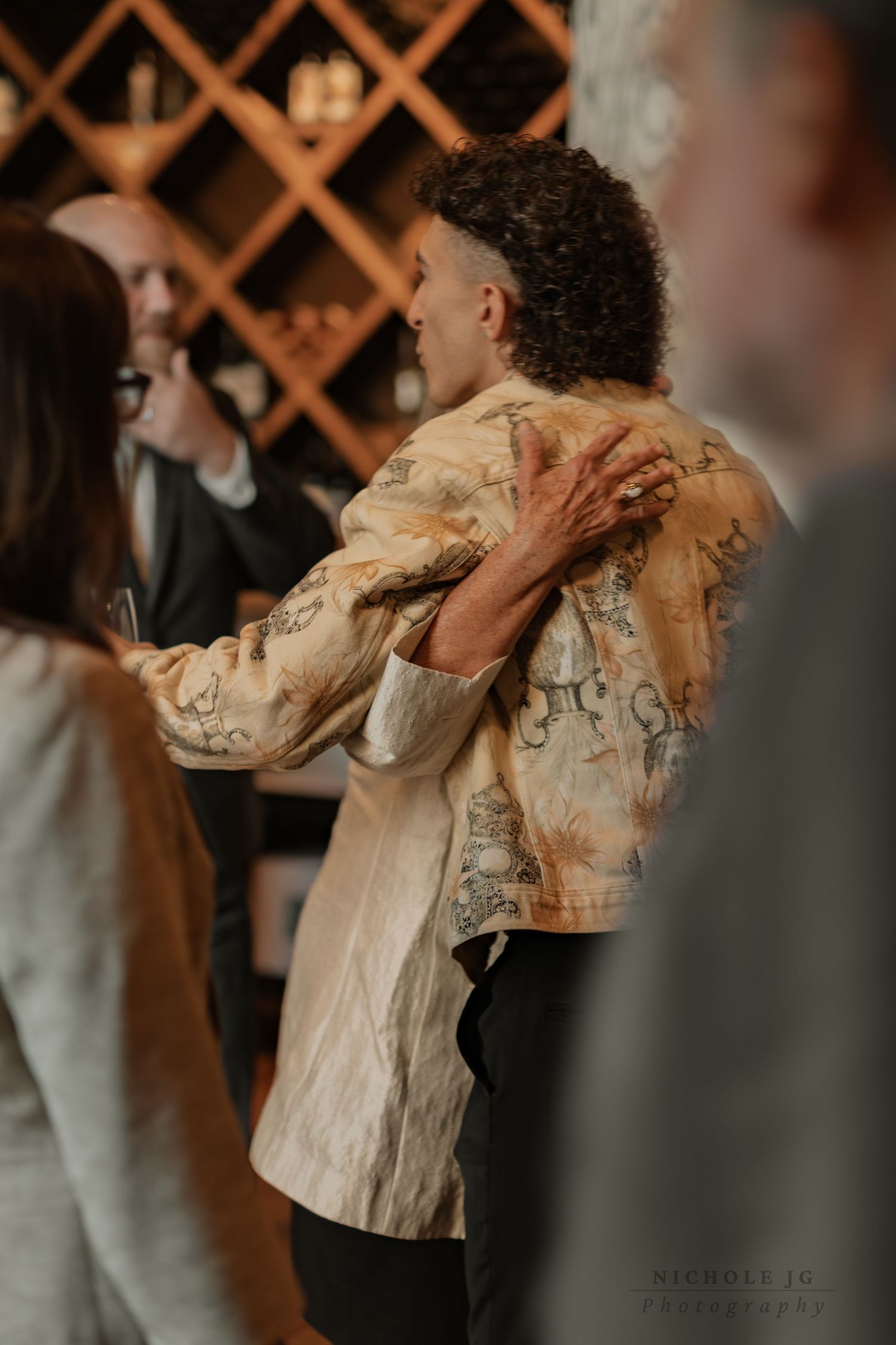Event photo of guests celebrating in Hudson Valley venue, candid & inclusive. Captured by Nichole JG Photography.