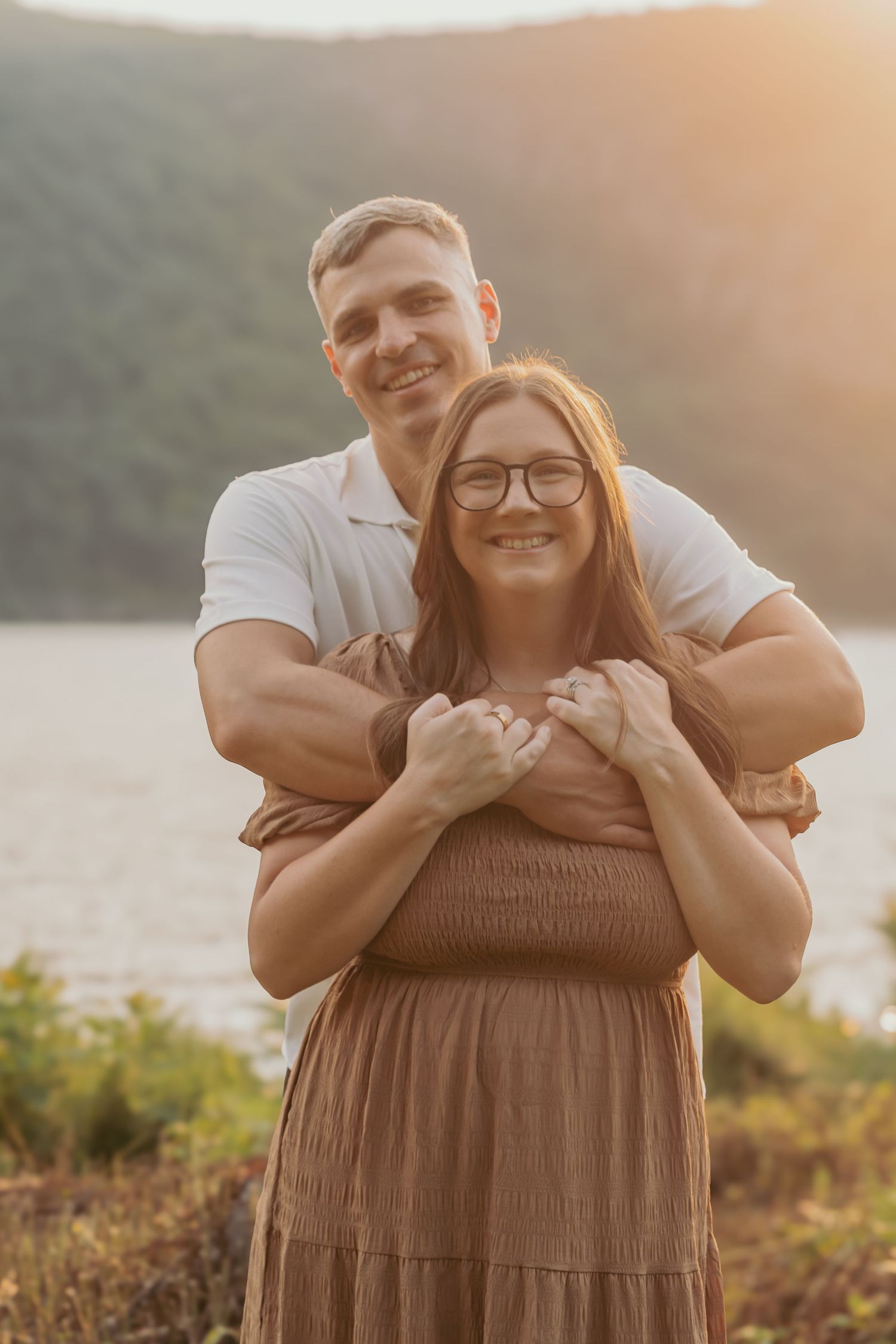 Sunset couple portrait at Hudson Valley park, featuring warm, candid storytelling. Captured by Nichole JG Photography in Hudson Valley