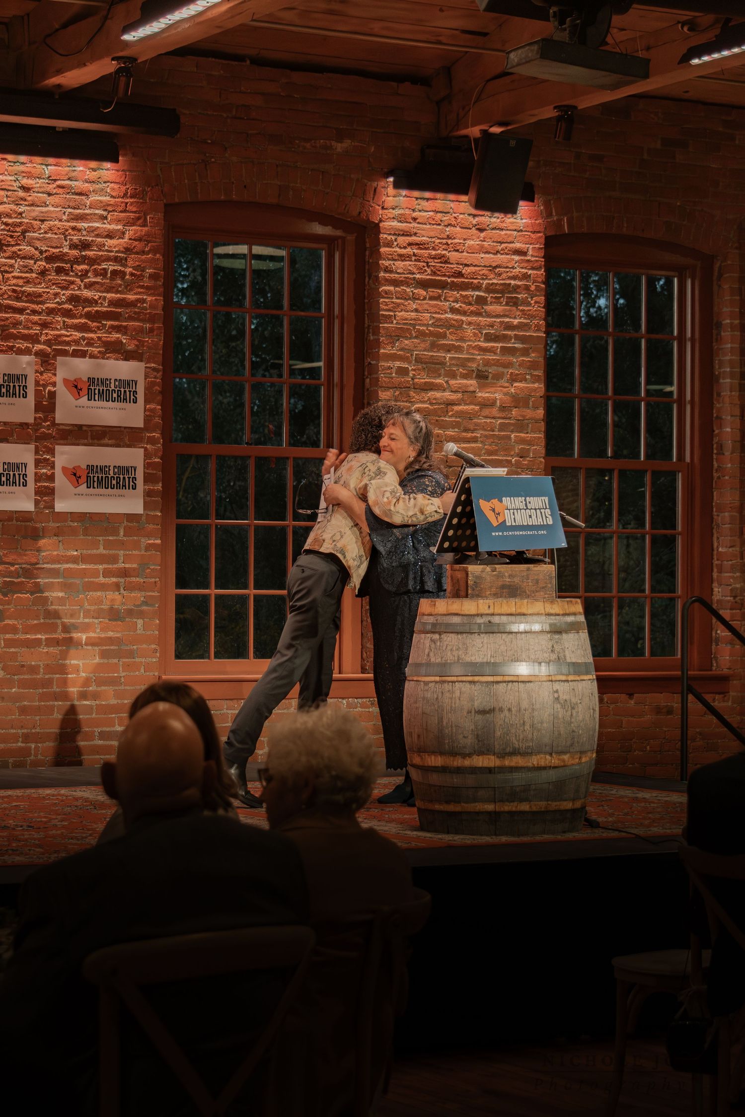 Event photo of guests celebrating in Hudson Valley venue, candid & inclusive. Captured by Nichole JG Photography.