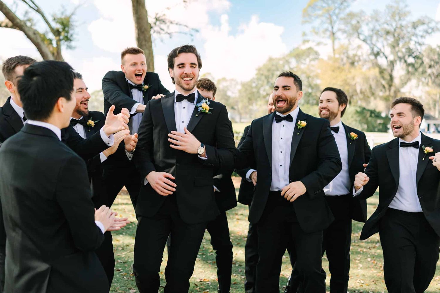groom and groomsmen laughing