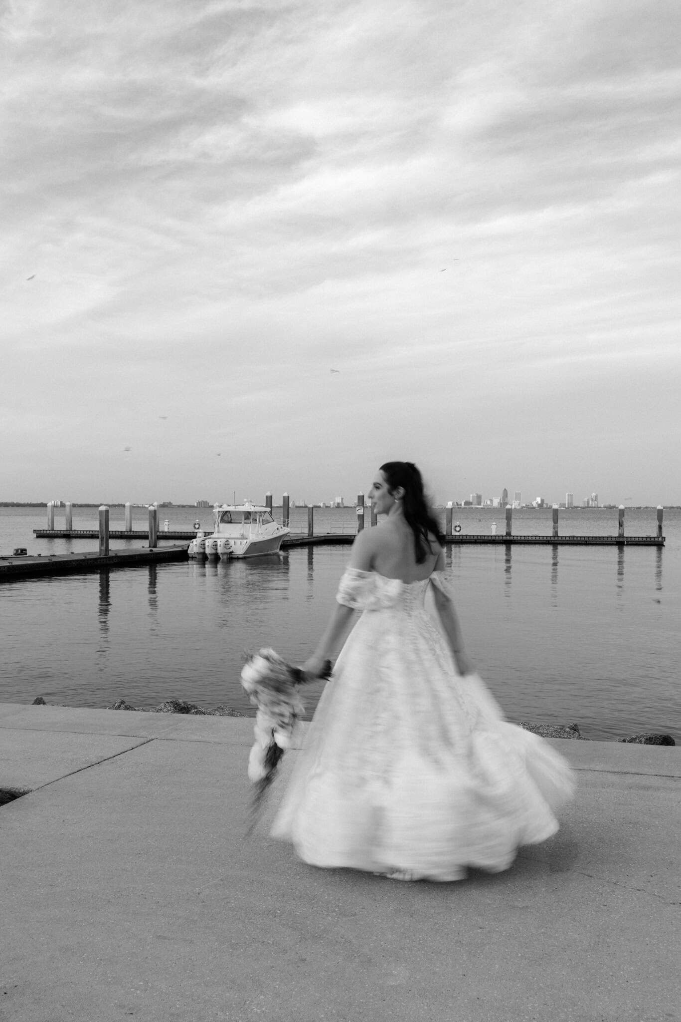 bride twirling in black and white and motion blur