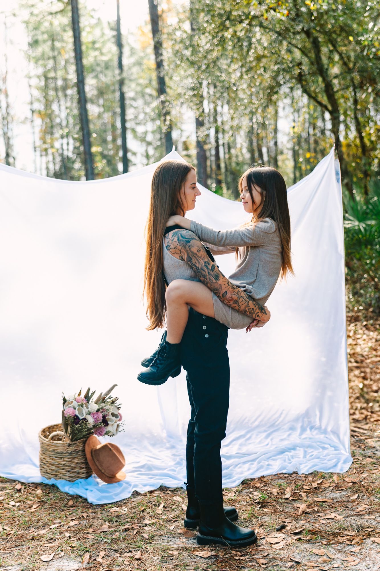 mom holding daughter