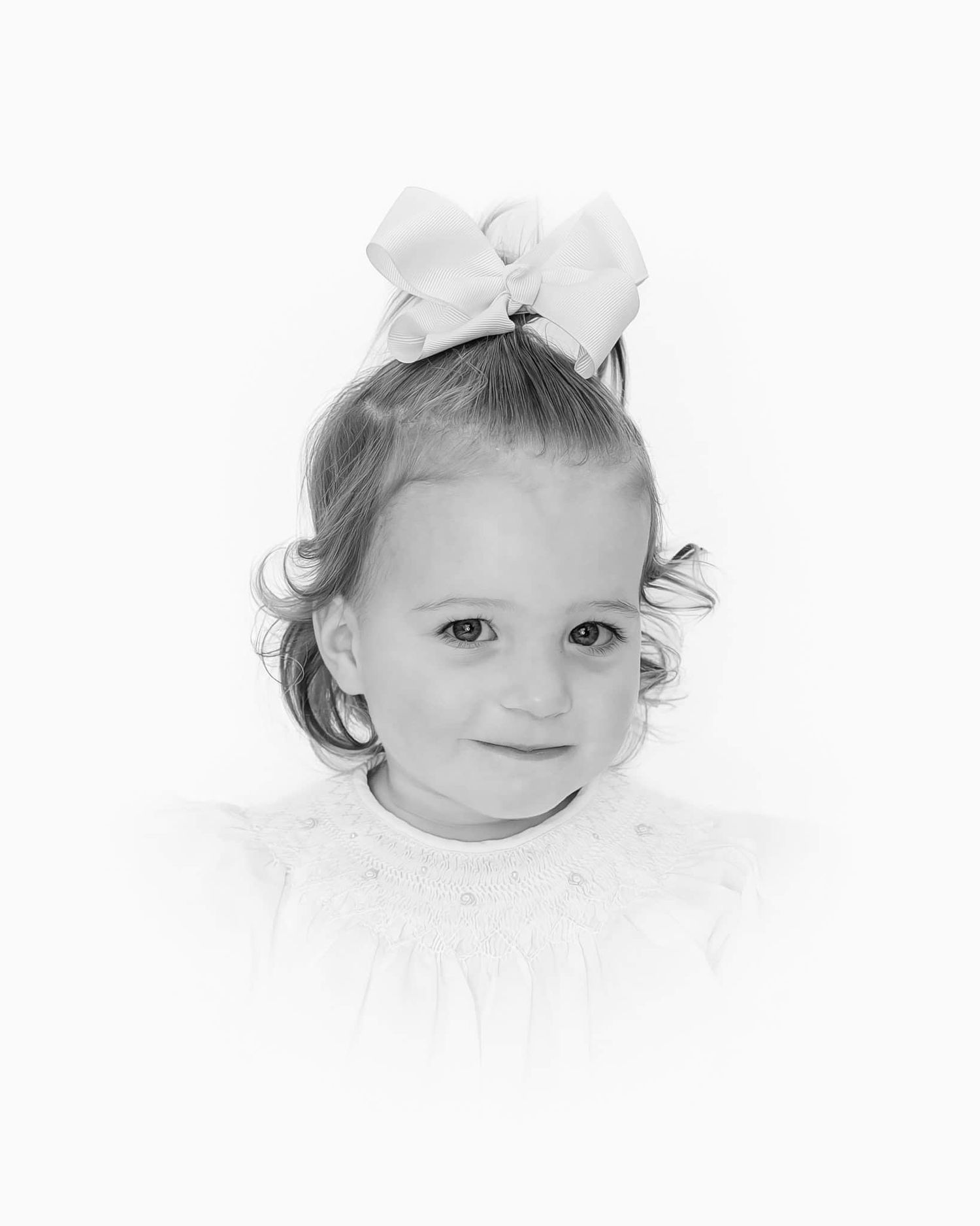 heirloom portrait in black and white of little girl with big bow and curls